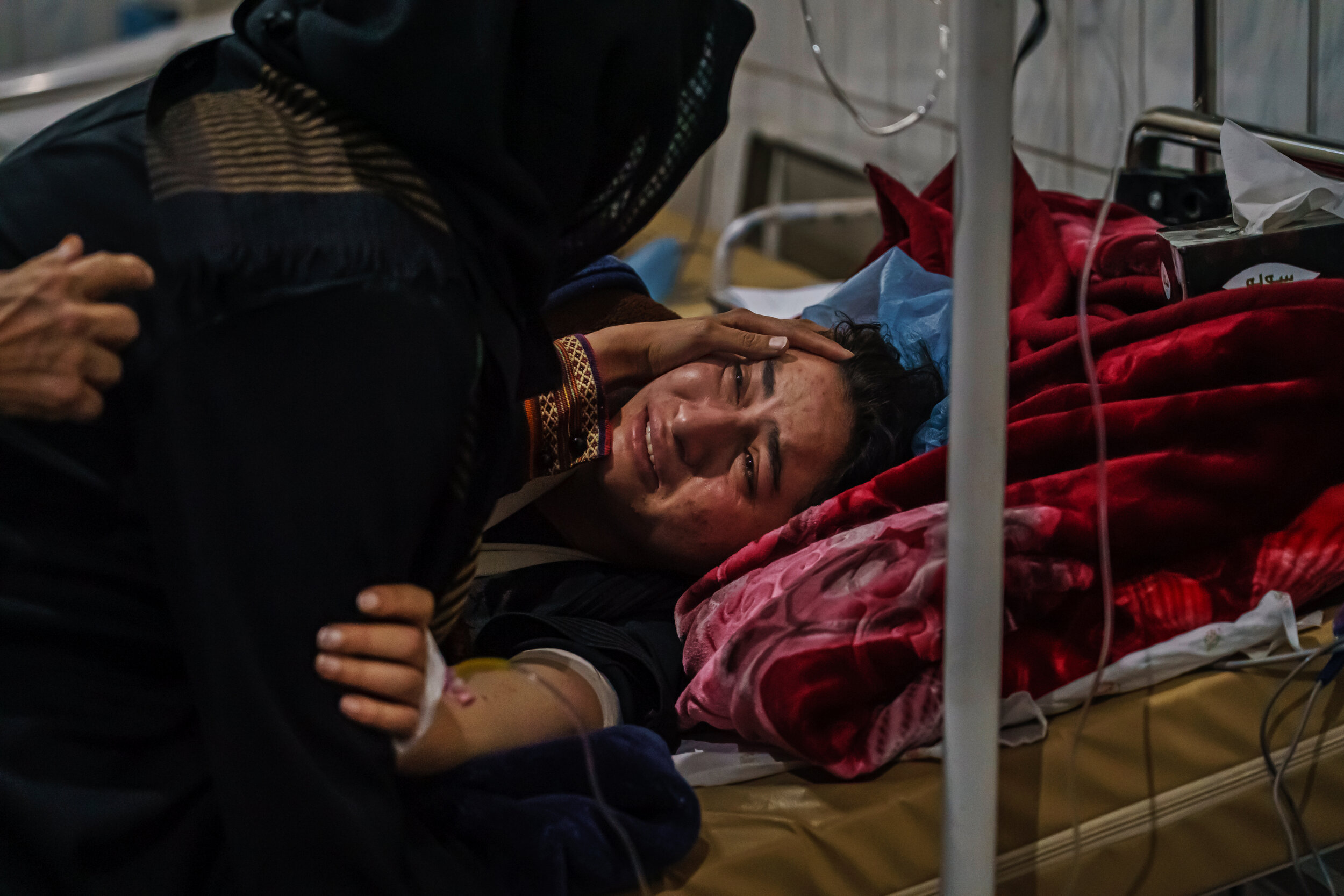  Nahida Muhradi, a 22-year-old law student weeps as she is reunited with family members while recovering from her gunshot wounds, sustained after a recent attack on Kabul University, Afghanistans largest university, where three gunmen fired weapons a