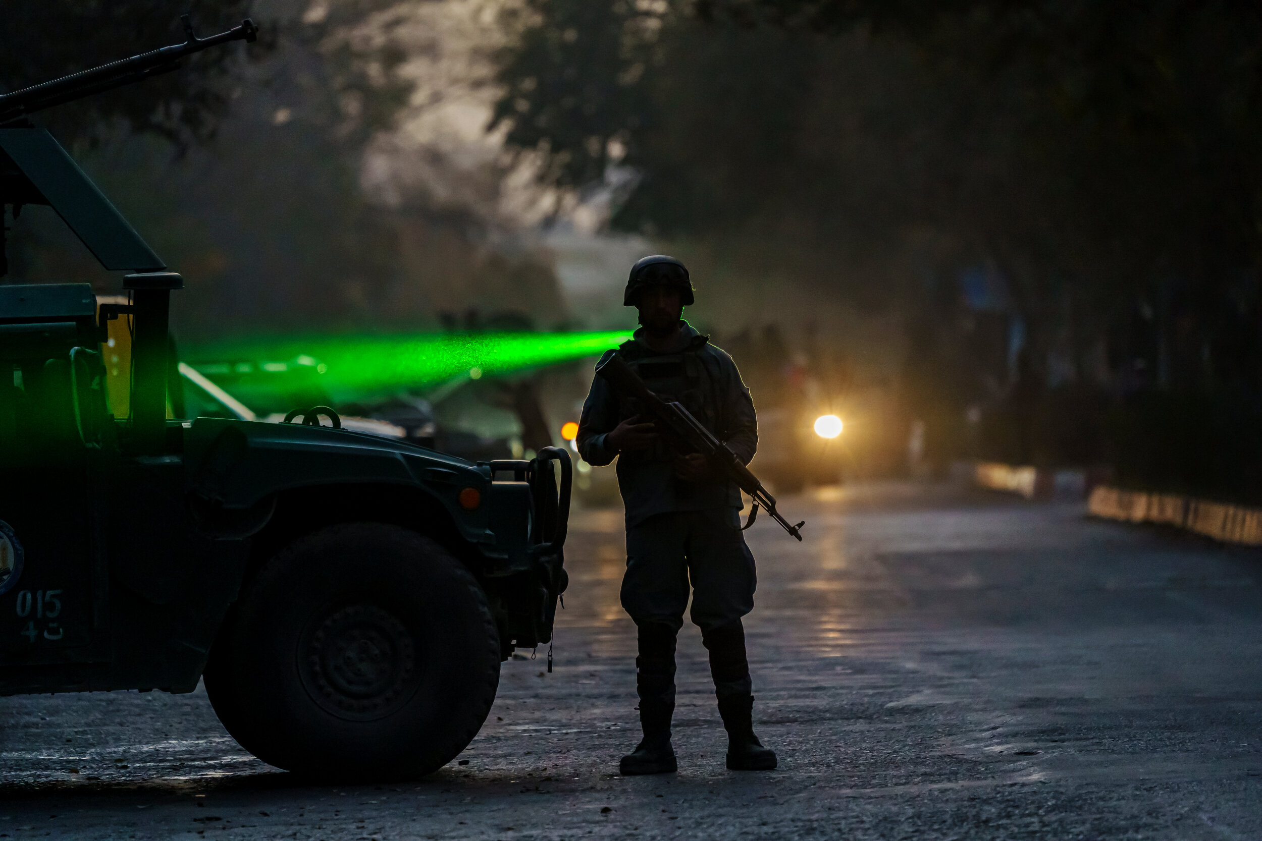  Security forces guard the perimeter after an attack on Kabul University, Afghanistans largest university, where three gunmen fired weapons and detonated explosives, concentrating their attacks in the the law faculty building, the National Legal Trai