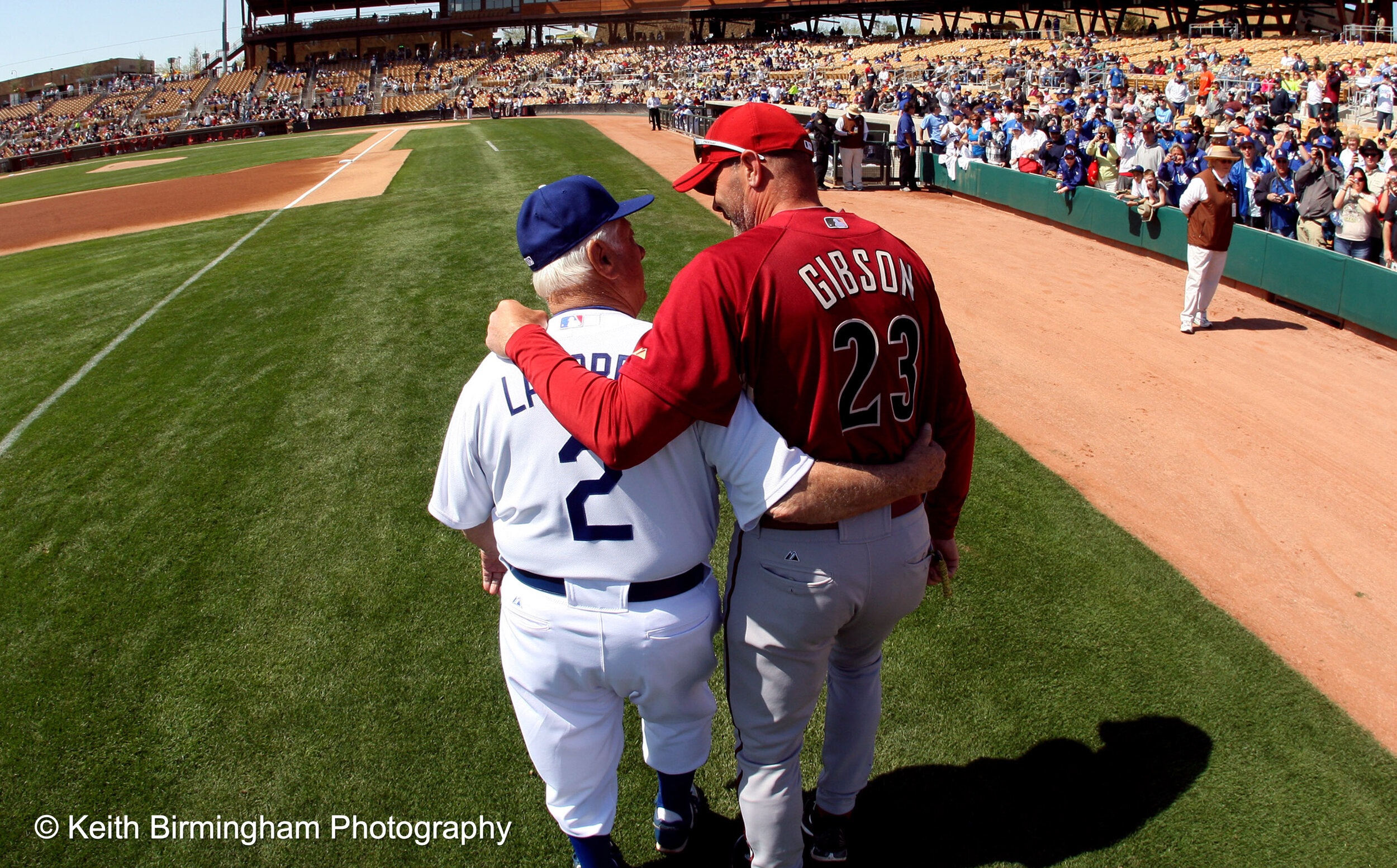  Los Angeles Dodgers former manager Tommy Lasorda and former Dodger great and current Arizona Diamondbacks bench coach Kirk Gibson (23) share a moment before a game at the Ballpark at Camelback Ranch on Wednesday, March 10, 2010, in Glendale,Arizona.