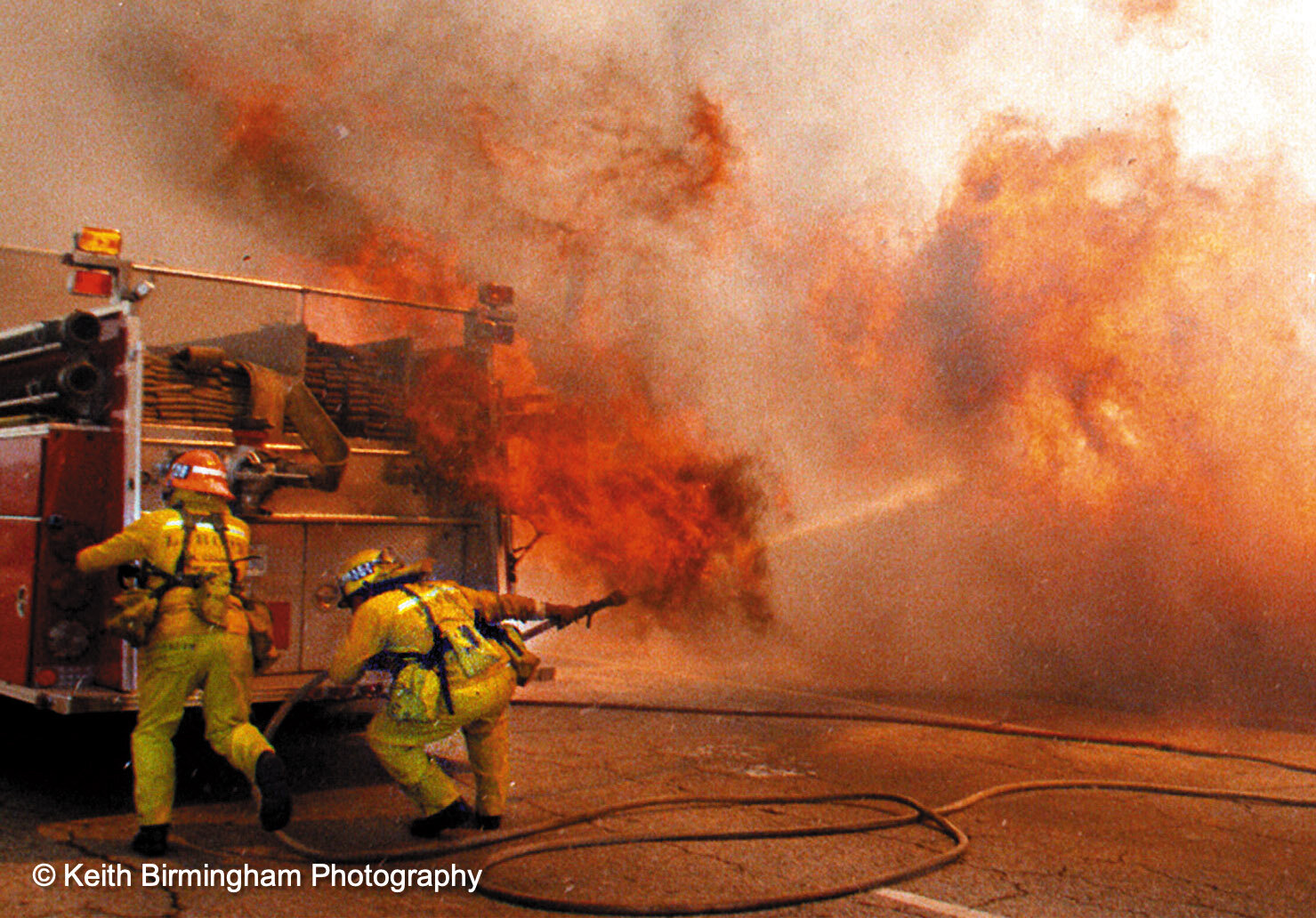  Firefighters from company 29 out of Baldwin Park try to fight back the flames from a brush fire in the wash on Foothill Blvd. in Irwindale as the flames rises over the engine company. (Photo by Keith Birmingham, Pasadena Star-News/ SCNG) 