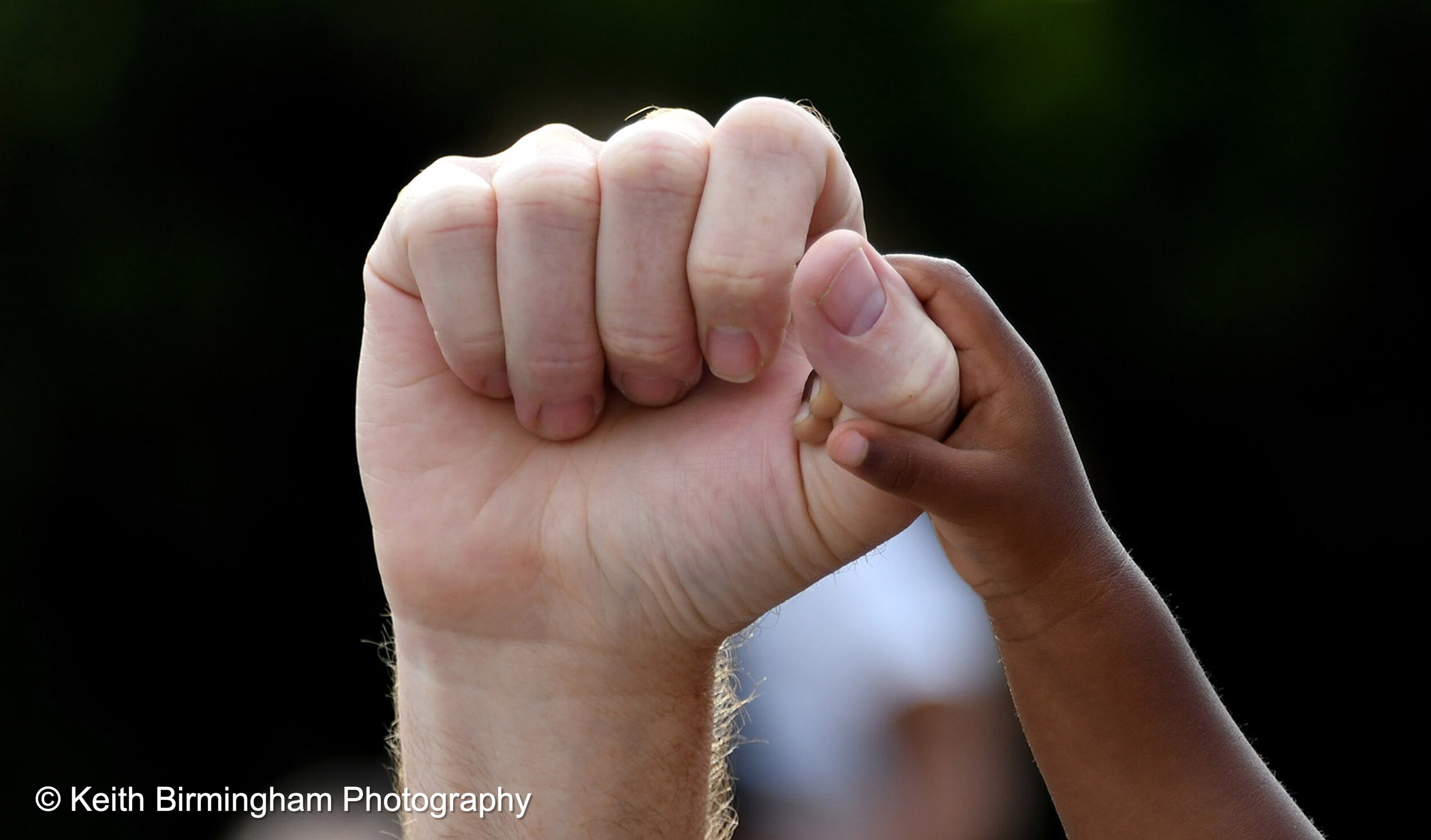  Eric Puestow of Pasadena with his 1 1/2 year-old daughter Simone holds his fist up as she holds onto his hand as thousands of demonstrators caravan to the Pasadena City Hall to protest and hold a vigil after the death of George Floyd, a black man wh