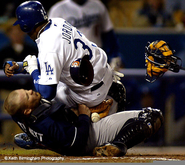  Los Angeles: Brian Jordan ,33, of the Los Angeles Dodgers slams into San Diego Padre's catcher Gary Bennett  ,29,  as he couldn't hold the throw by rightfielder Xaiver Nady ,22, and scores the 3rd run in the bottom 6th inning after at Dodger Stadium