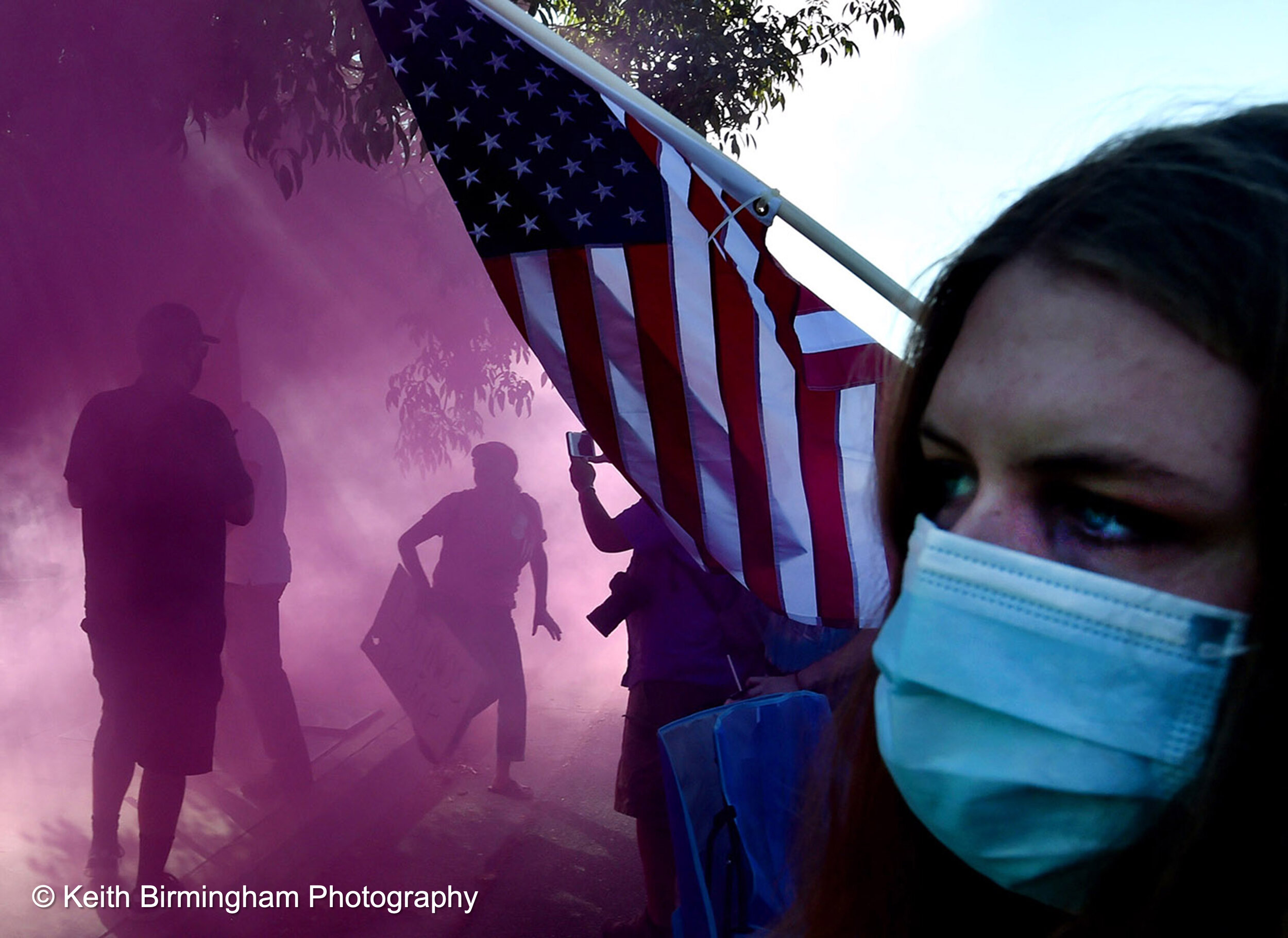 Colored smoke bombs fill the air as Pro Trump supporters clash with Black Lives Matter protestors during a rally along Foothill Blvd between the Albertsons and In-N-Out Burger in Tujunga, California on Friday, August 14, 2020. (Photo by Keith Birmin