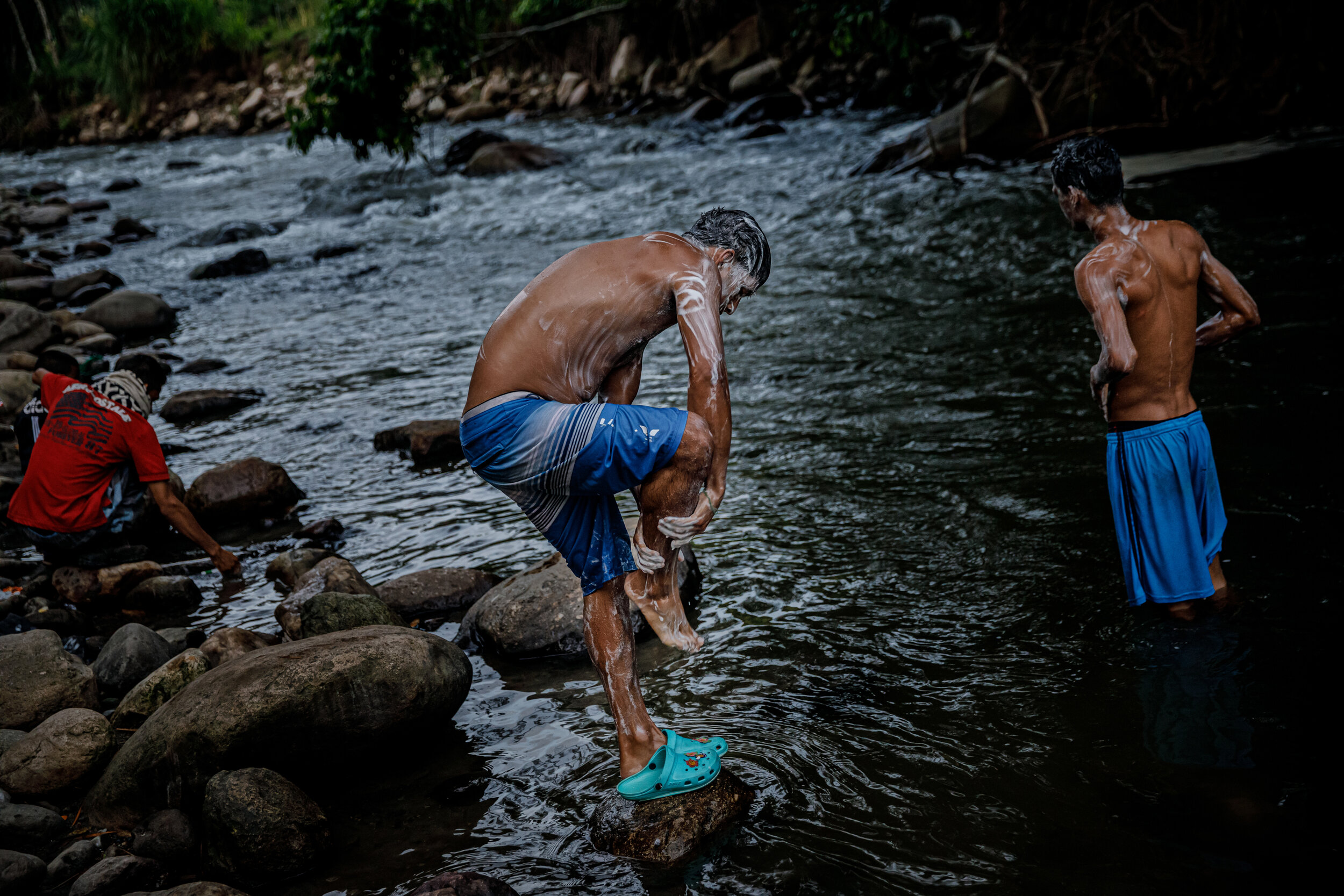  Venezuelans migrants traveling by foot, take a bath in the river at the campgrounds in Bochalema, Colombia, before they start on their aÊ120-mileÊjourney on that climbs more than 9,000 feet to a long and frigid plateau El Pramo de Berl’n before desc