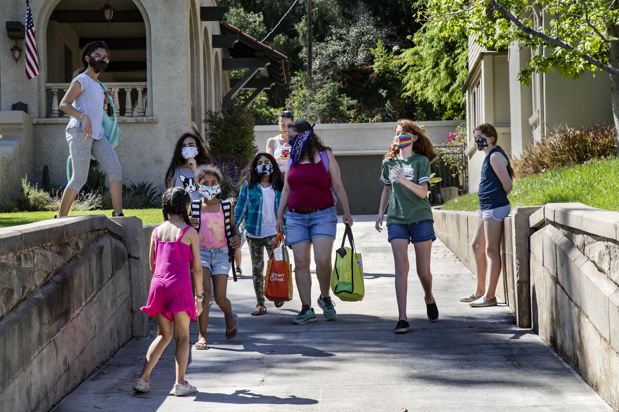  RIVERSIDE, CA- APRIL 23, 2020: Students and parents of “Brothbush Academy” walk from the Bristow’s to the Furbush’s for a cooking  class during home school in the midst of the coronavirus pandemic on April 21, 2020 in Riverside, California. The Bris