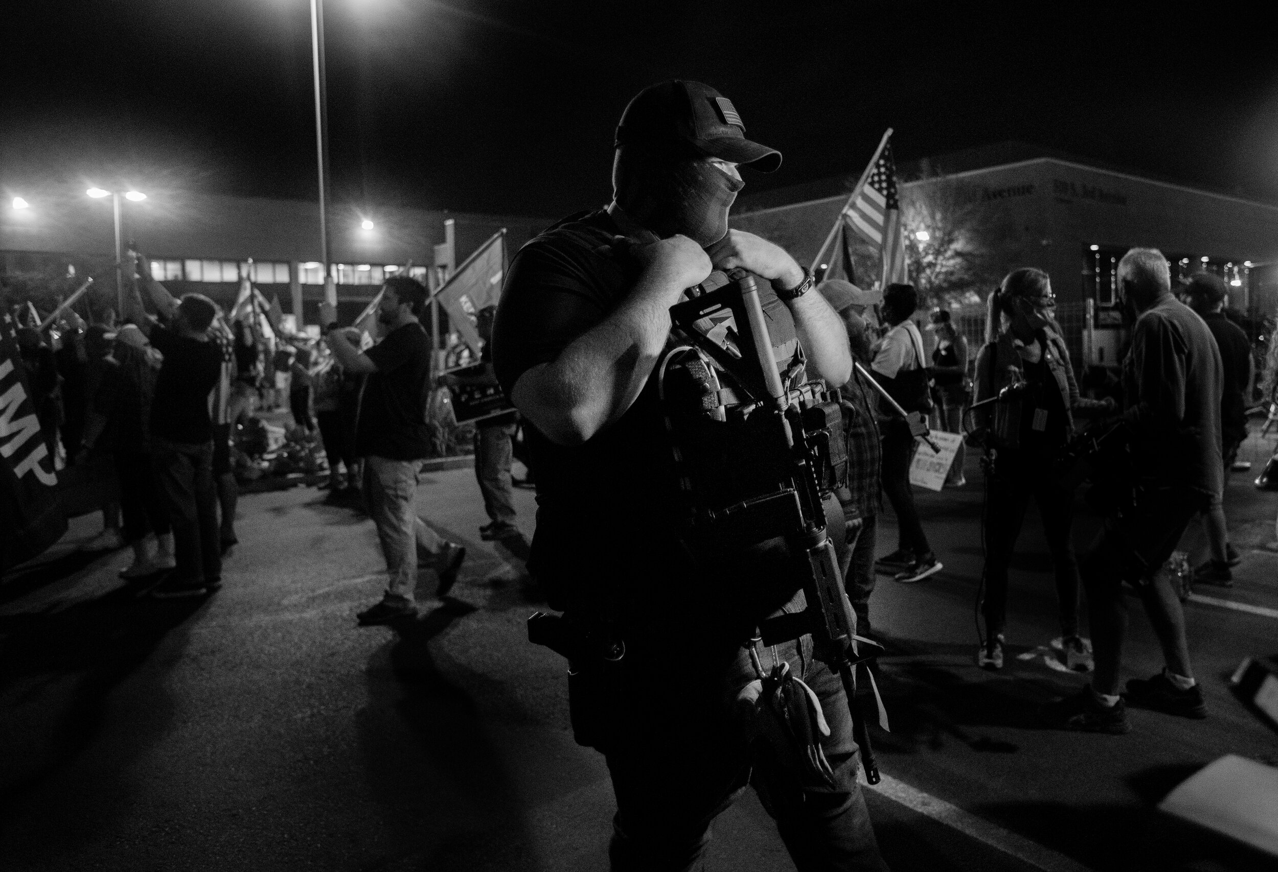  PHOENIX, AZ - NOVEMBER 5, 2020:  A gun toting Trump supporter who would only give his last name, Alan of Mesa, attends a  protest in the parking lot at the Maricopa  County Tabulation and Election Center as ballots continue to be counted inside the 