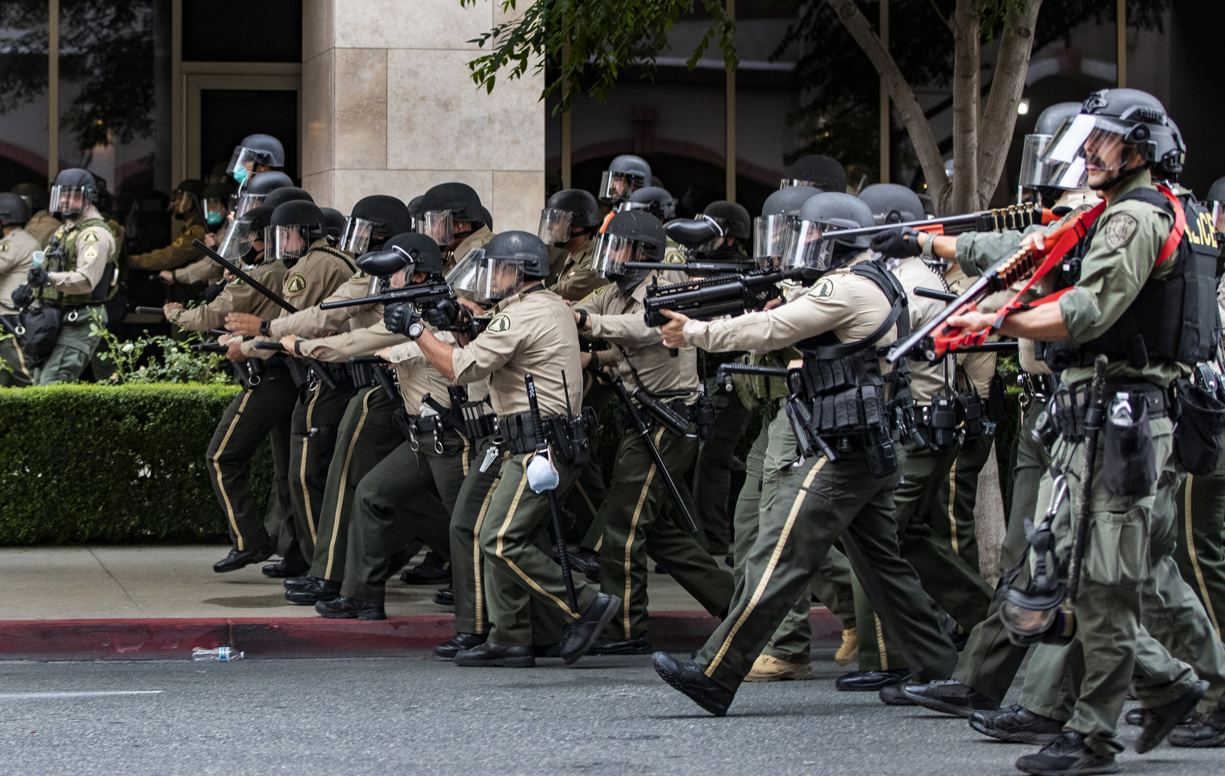  RIVERSIDE, CA - JUNE 1, 2020: Riverside County Sheriffs advance on demonstrators who refused to disperse after curfew during a protest against the death of George Floyd during the coronavirus pandemic on June 1, 2020 in Riverside, California. Thousa