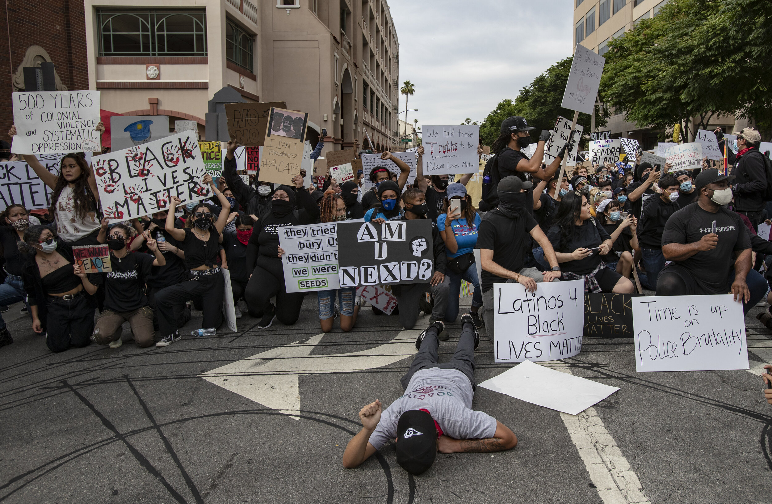  RIVERSIDE, CA - JUNE 1, 2020: Thousands of protesters marched to the Robert Presley Detention Center and were met with a road block of law enforcement during a protest against the death of George Floyd during the coronavirus pandemic on June 1, 2020