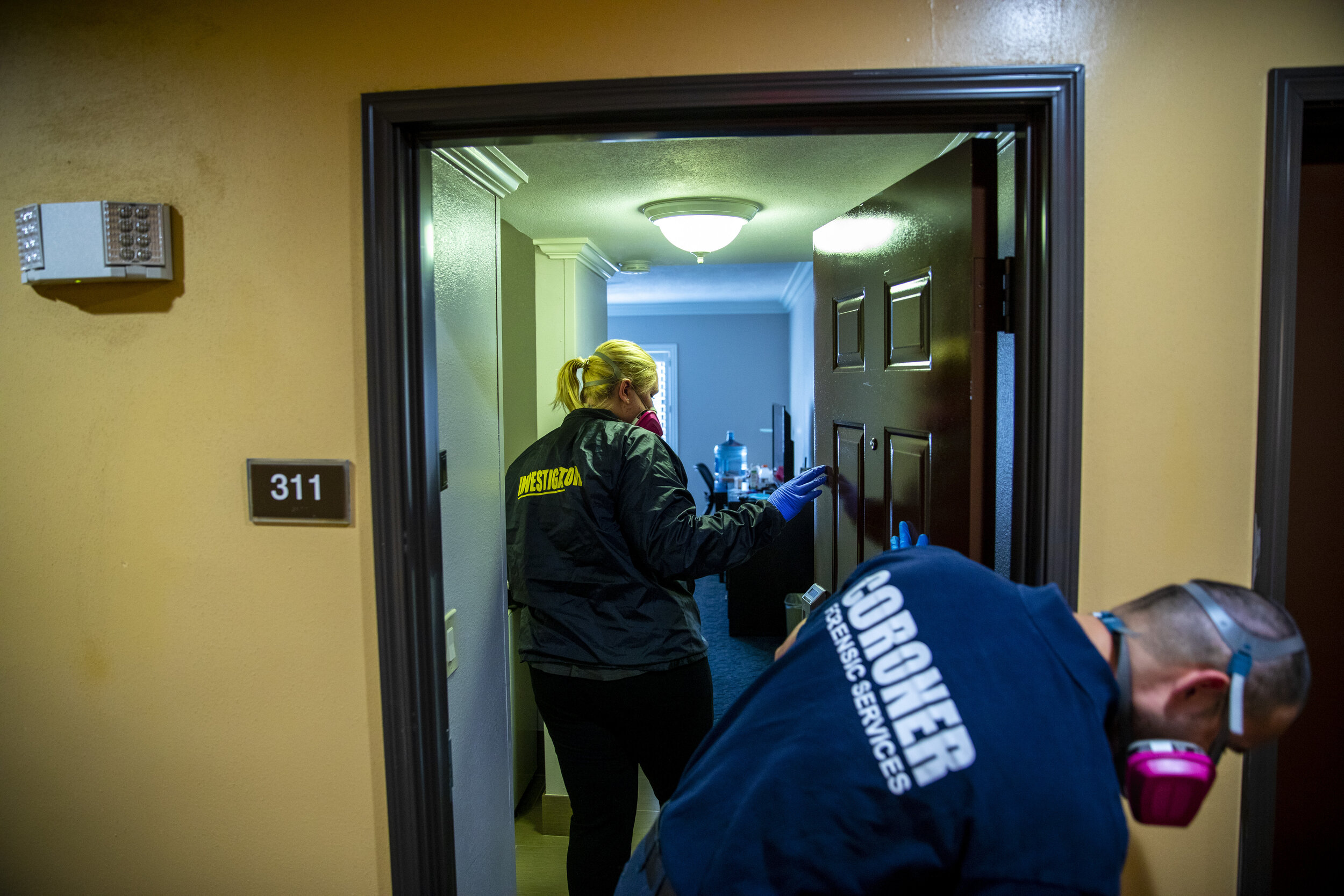  Kristina McGuire, an investigator with the Los Angeles County Dept. of Medical Examiner-Coroner enters a room at the Days Inn by Wyndham, in West Covina, with Jerry Meza, forensic attendant, where they recovered the lifeless body of Judy Bounthong, 