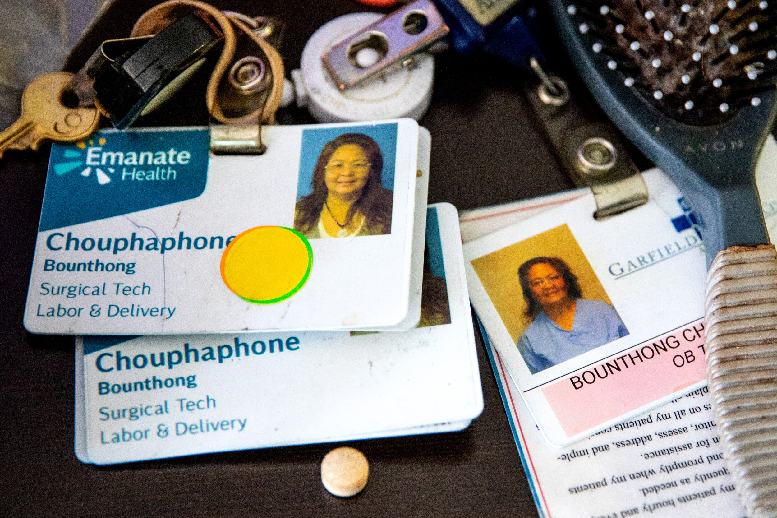  Work badges for Judy Bounthong, 58, an ob-gyn tech at Emanate Queen of the Valley Hospital, are found on a dresser, after her deceased body was discovered at the Days Inn by Wyndham, in West Covina, CA, on Tuesday, Oct. 13, 2020. Bounthong died of c