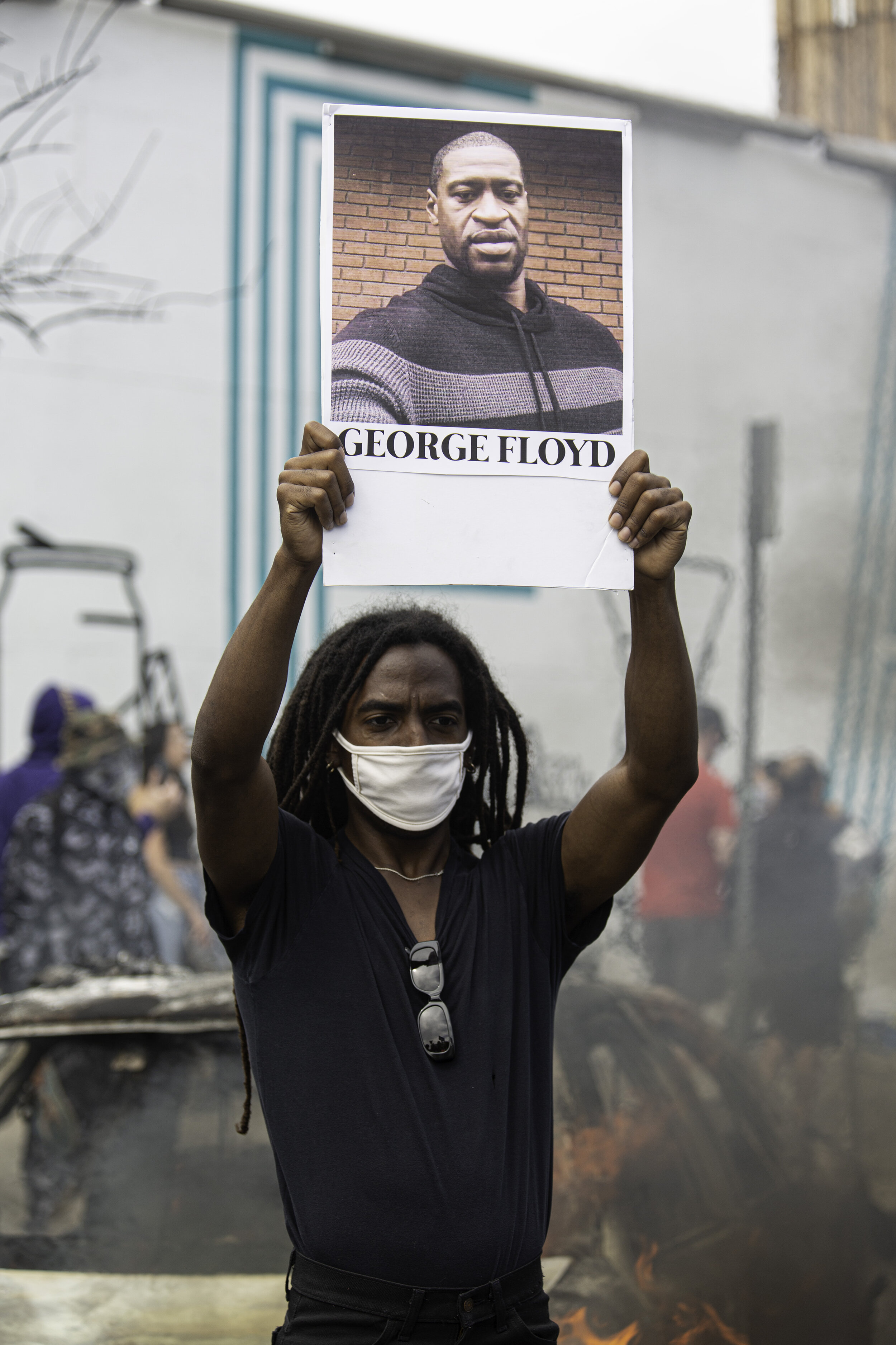   A protester holds a picture of George Floyd on Saturday, May 30, 2020, in Los Angeles, Calif. Floyd was killed by police in Minneapolis, MN on May 25, and within a few days protests erupted all over the country.  