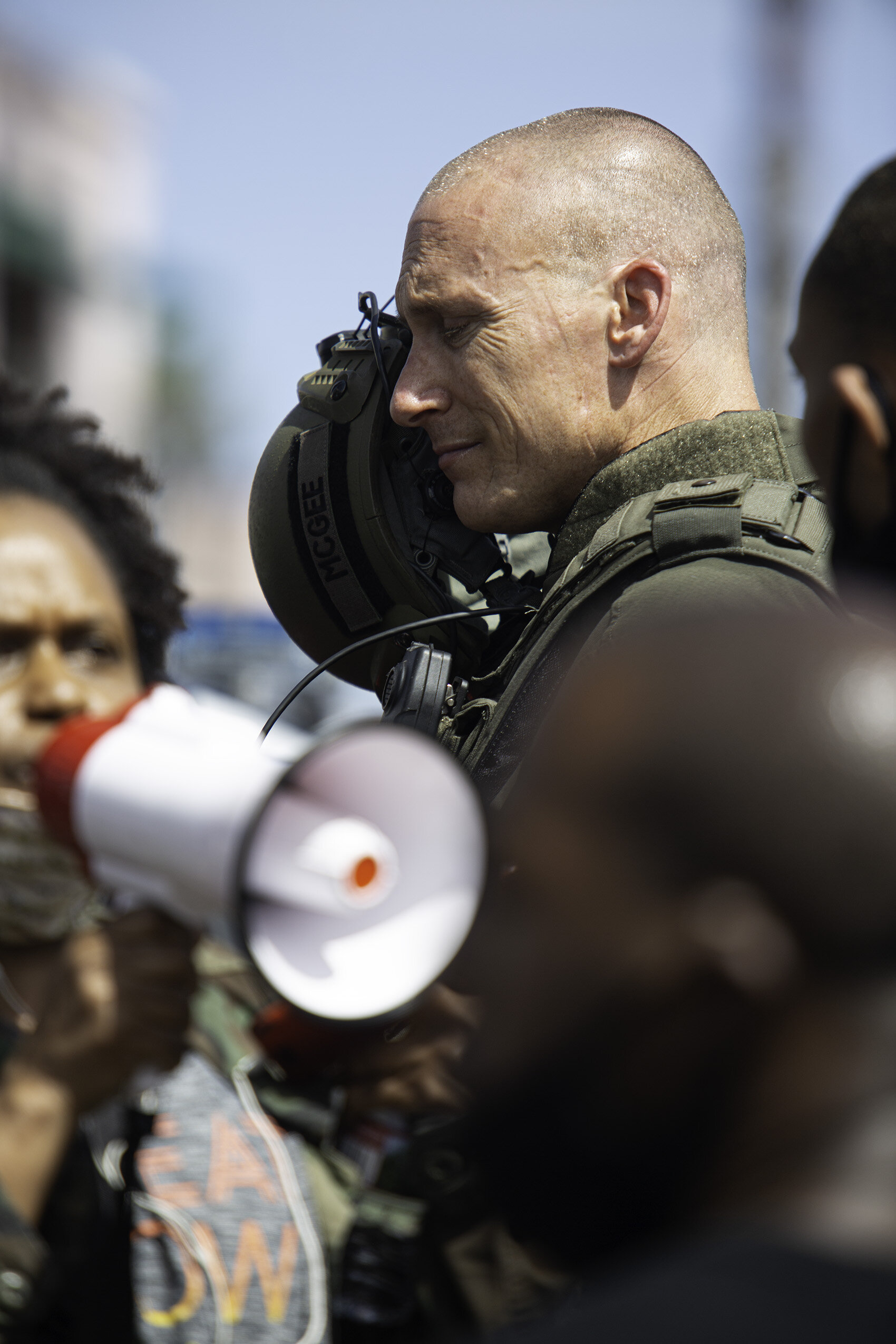  Sgt. Scott McGee of the Santa Monica Police Department removes his helmet and gas mask to talk to protesters during the Black. Lives Matter (BLM) protest on Sunday, May 31, 2020 on Ocean Avenue, in Santa Monica, Calif.  