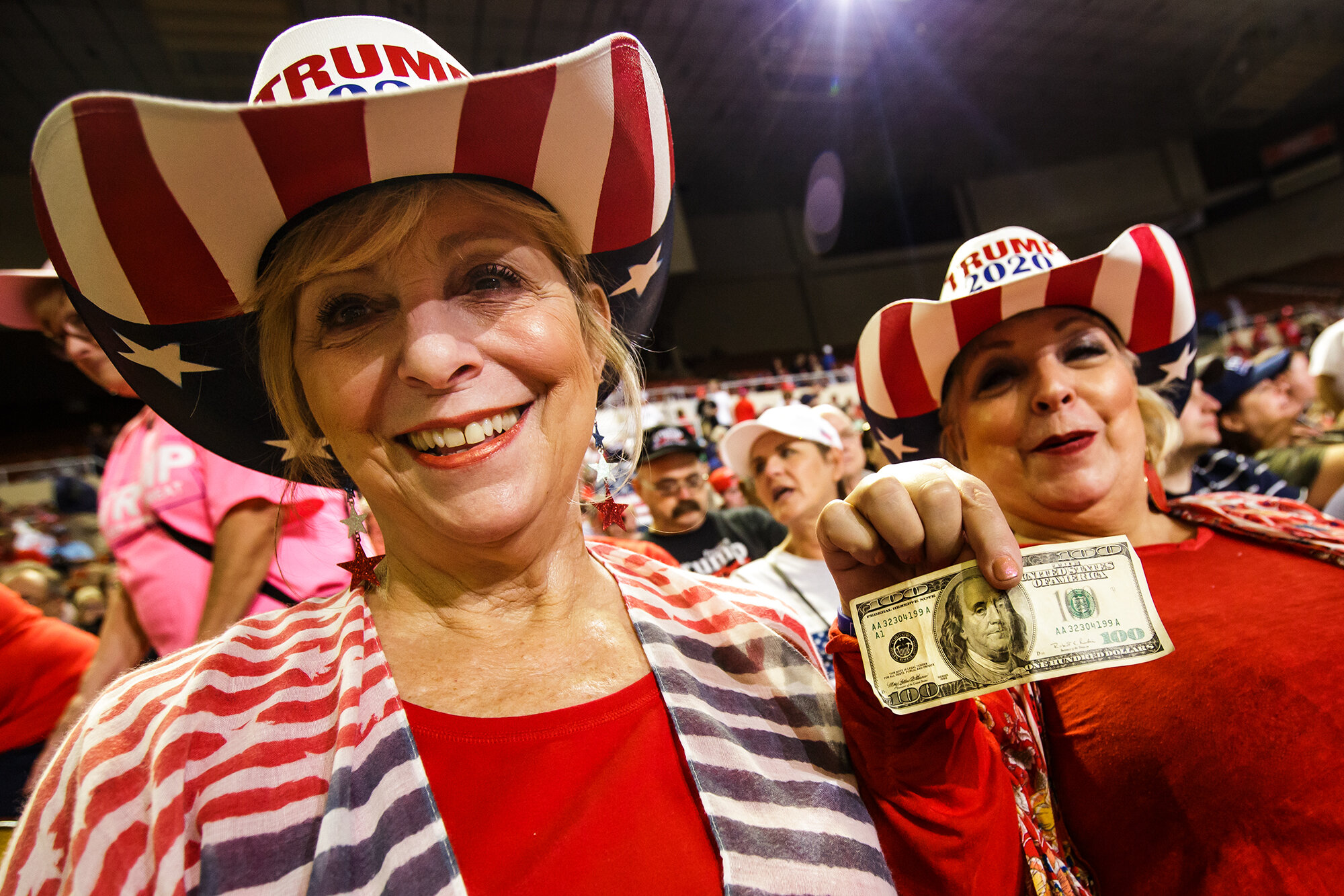  Ann Marie Pierson, and her sister, Theresa Kendinian, both of Pasadena, Calif., enjoy themselves as they wait for the arrival of President Donald Trump at a campaign event for his re-election, at the Arizona Veterans Memorial Coliseum in Phoenix, Ar
