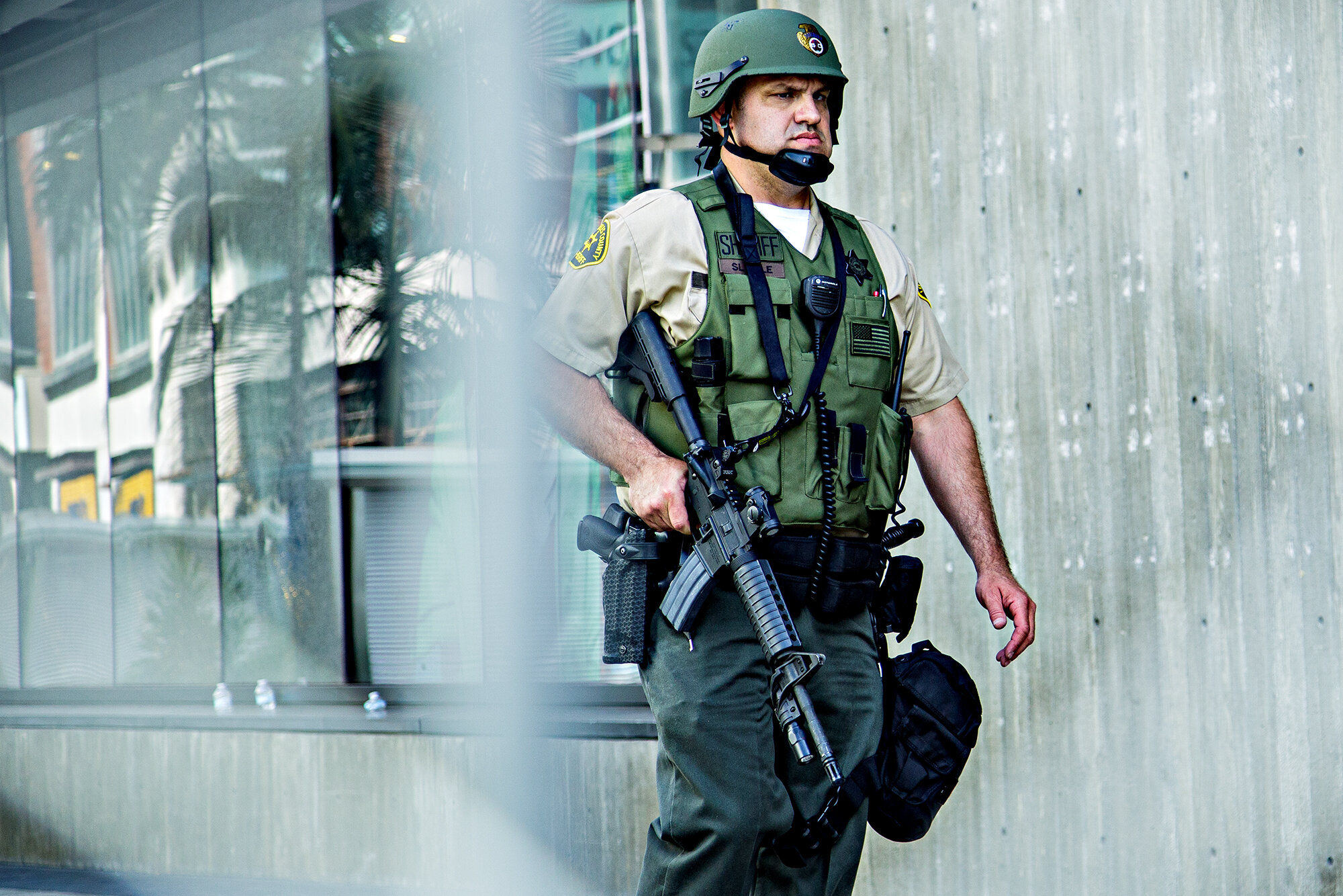  A Los Angeles County sheriff deputy patrols the Santa Monica Place mall, in Santa Monica, Calif., on Sunday, May 31, 2020. In expectation of civil unrest, the mall had been sealed off with chain link fencing, and many stores that faced out towards s