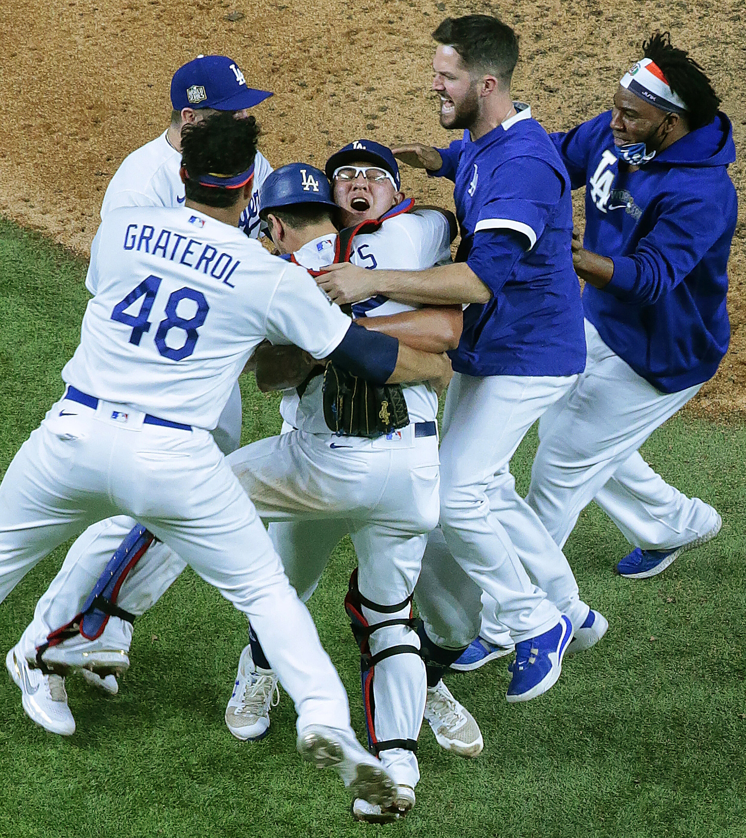  Arlington, Texas,  Tuesday, October 27, 2020 - Julio Urias is mobbed as the Dodgers win the World Series at Globe Life Field. The Dodgers beat the Tampa Rays in six games, 32 years after their last championship. 