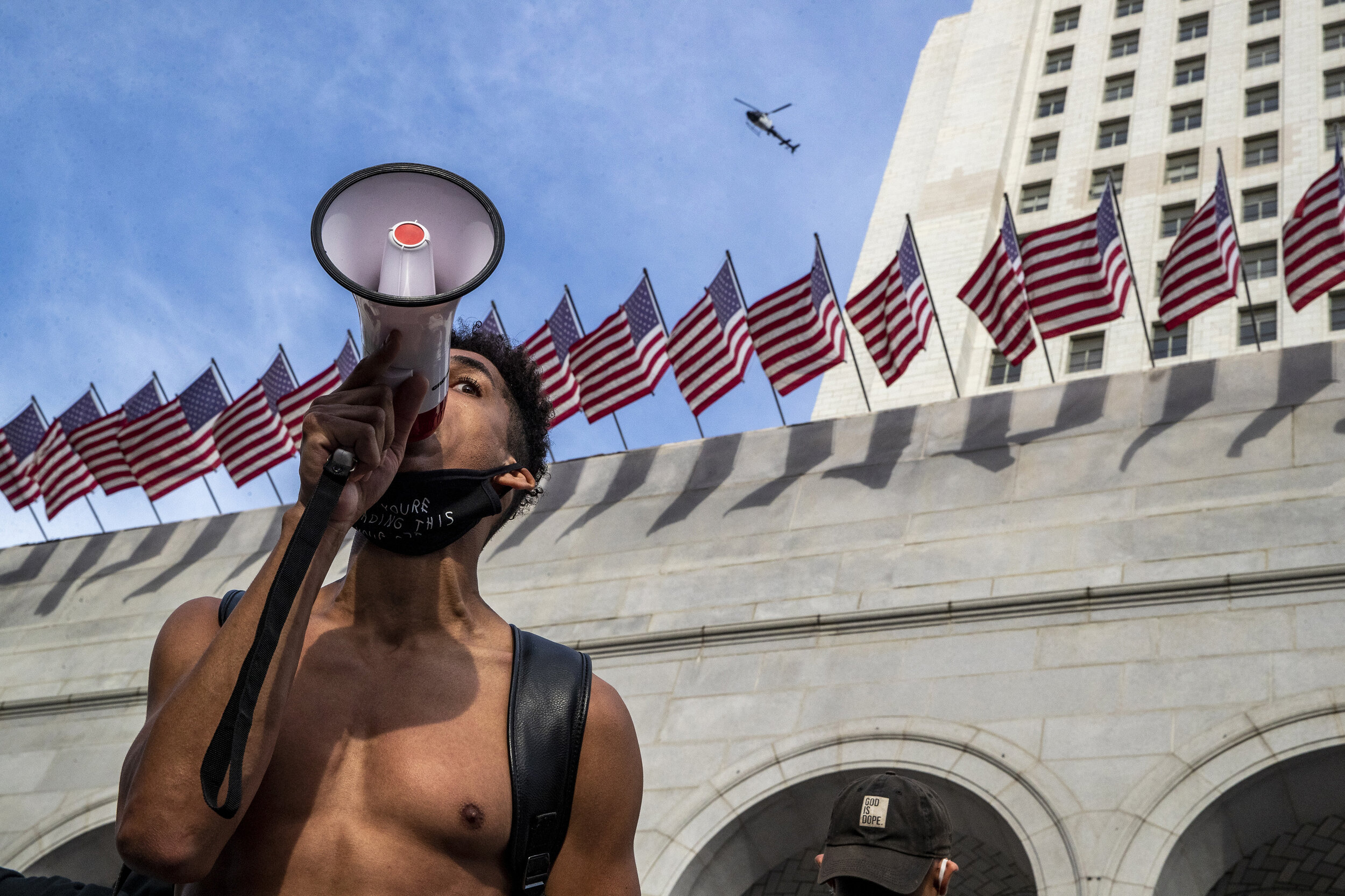  Marcus Owen, with bullhorn, leads a rally for George Floyd as hundreds of protesters gather outside Los Angeles City Hall in a daylong protest on June 2.  A week after Minneapolis Police Office Derek Chauvin kneeled on the neck of George Floyd for n