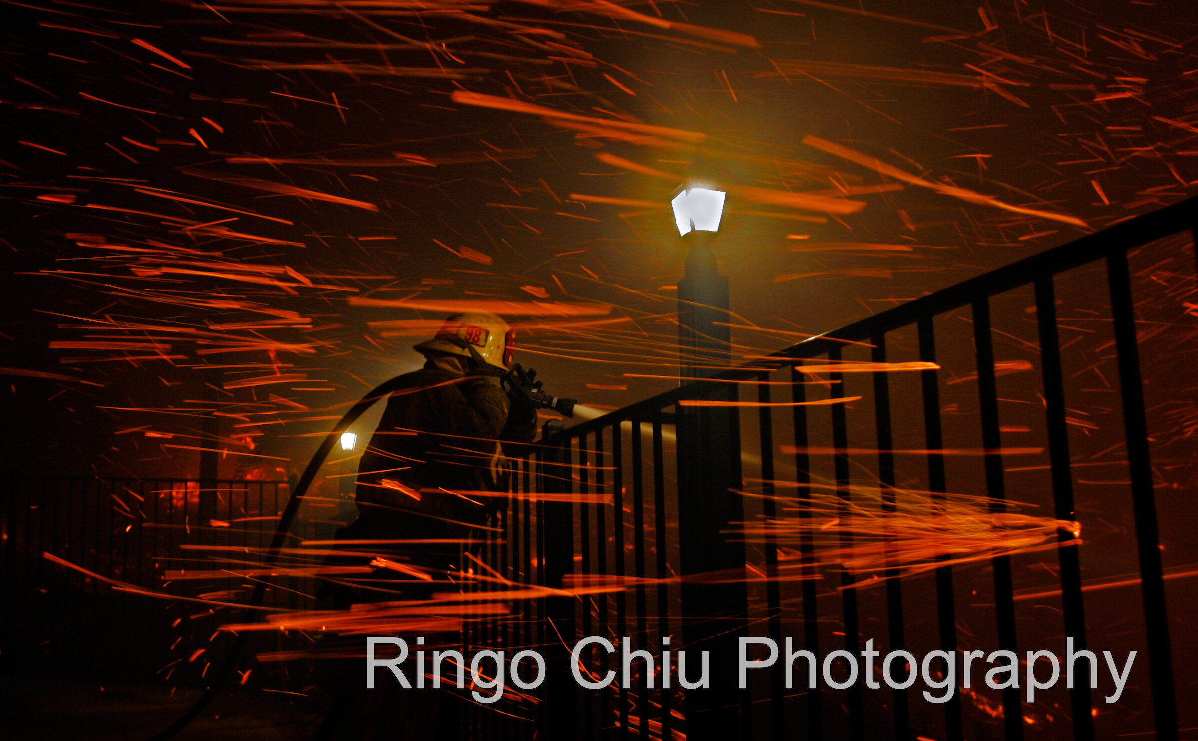  A firefighter battles brush fire that started along the Simi Valley freeway in Chatsworth, California, September 29, 2005. 