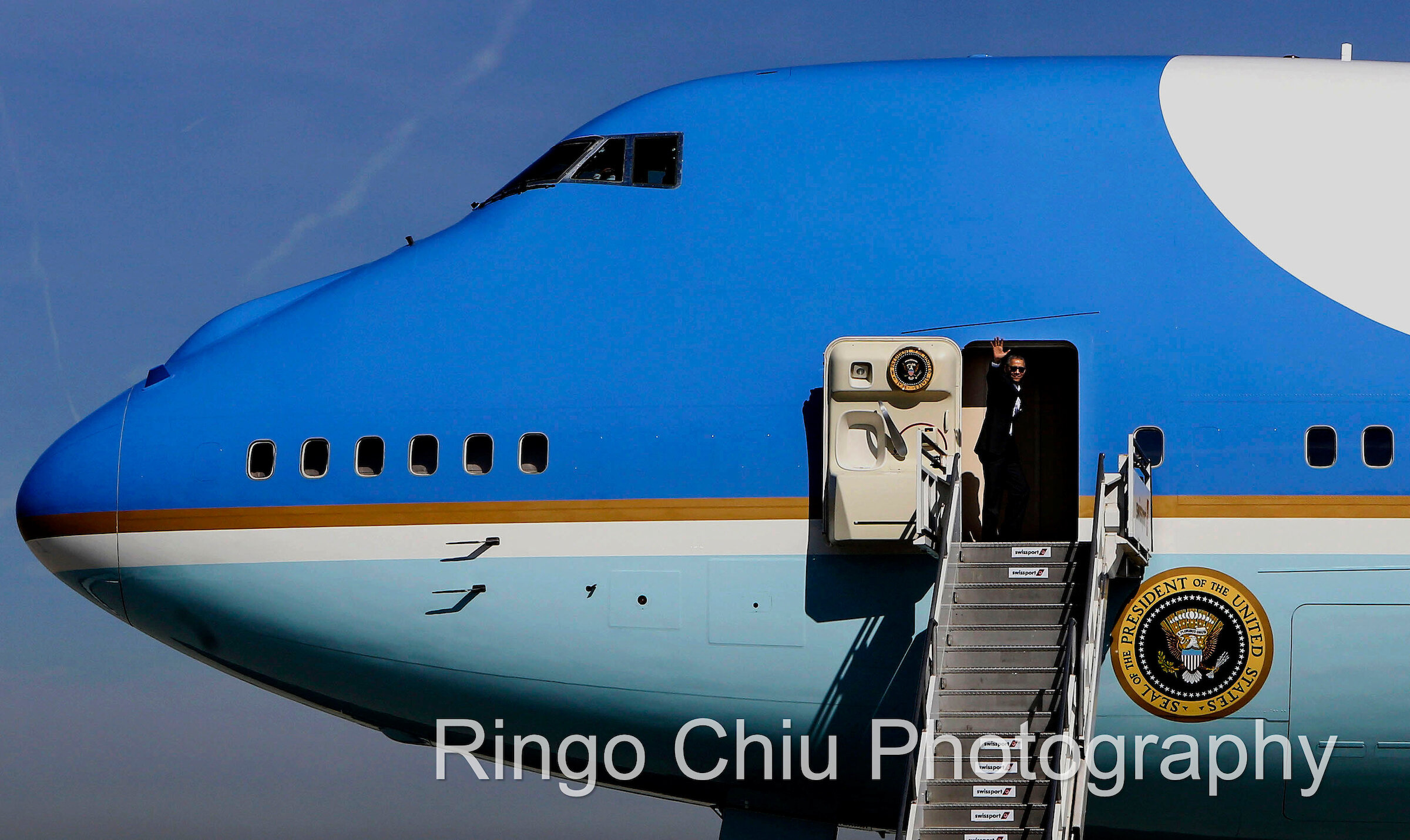  President Barack Obama, waves as he boards Air Force One at Los Angeles International Airport in Los Angeles, Friday, Feb 12, 2016. 