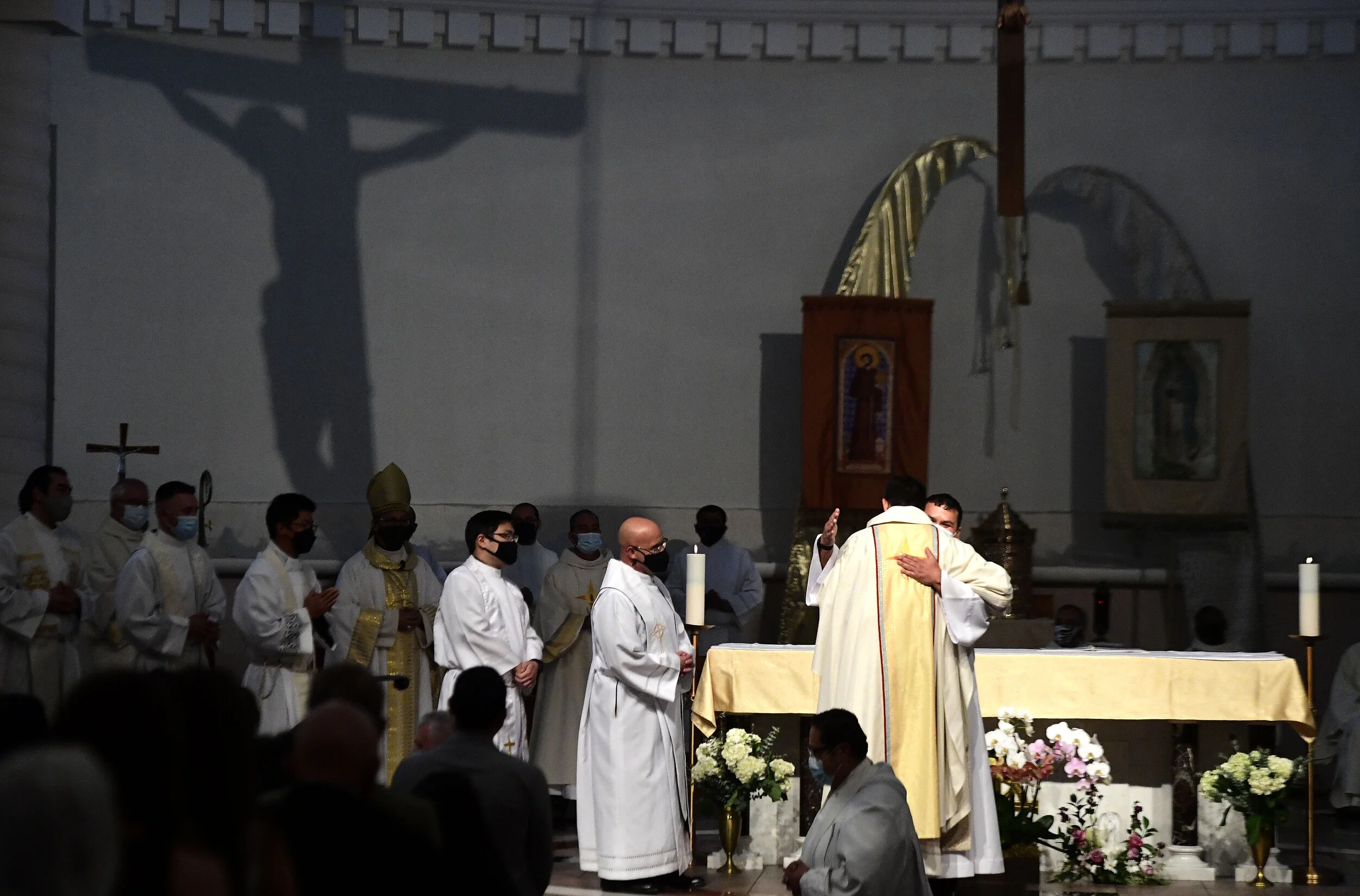  Father Ian Francisco Hollick, 34 from Corona, is hugged and congratulated by other priest during Hollick’s Ordination to the Priesthood mass at Sacred Heart Church in Rancho Cucamonga Saturday morning May 29, 2021. Father Ian Hollick was assigned to