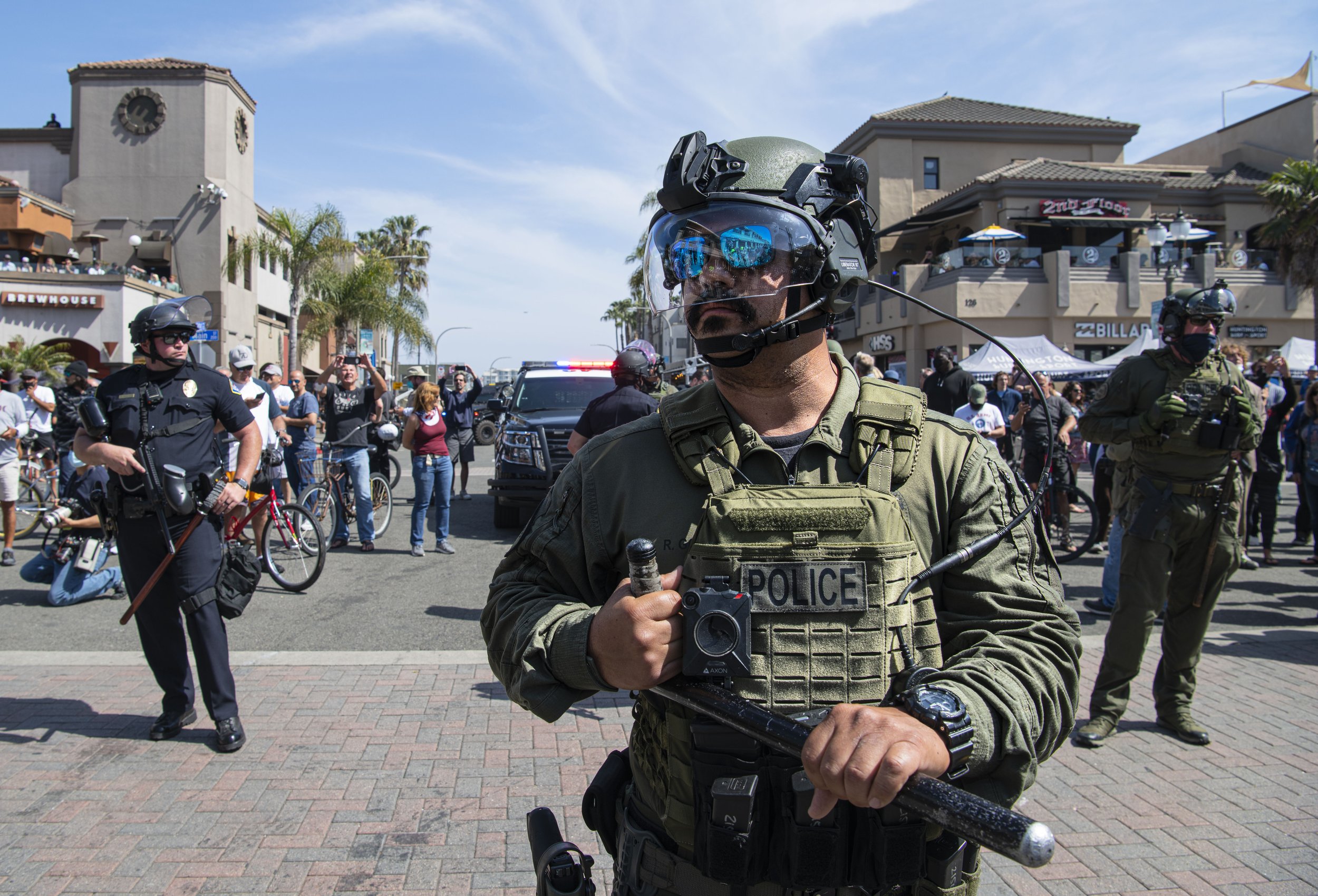  Huntington Beach Police officers assemble to dispurse the angry crowds at the Black Lives Matter/ White Lives Matter protest held in Huntington Beach Calif. on March 11, 2021. 
