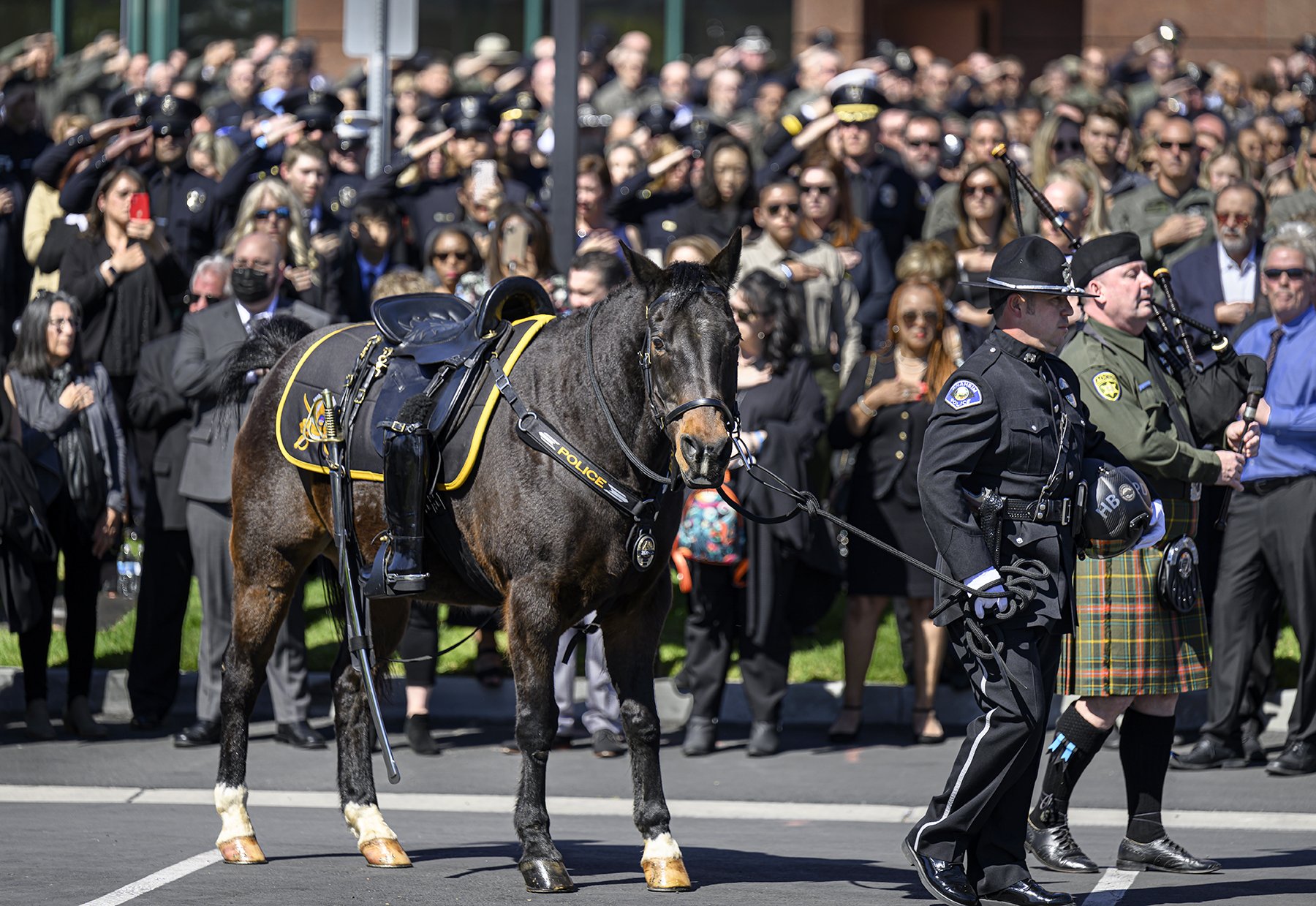  A riderless horse with reversed boots symbolizes the last ride of fallen officer Nicholas Vella who died in a helicopter crash Feb. 19 off the waters in Newport Beach. Funeral services took place at the Honda Center in Anaheim on Tuesday, March 8, 2