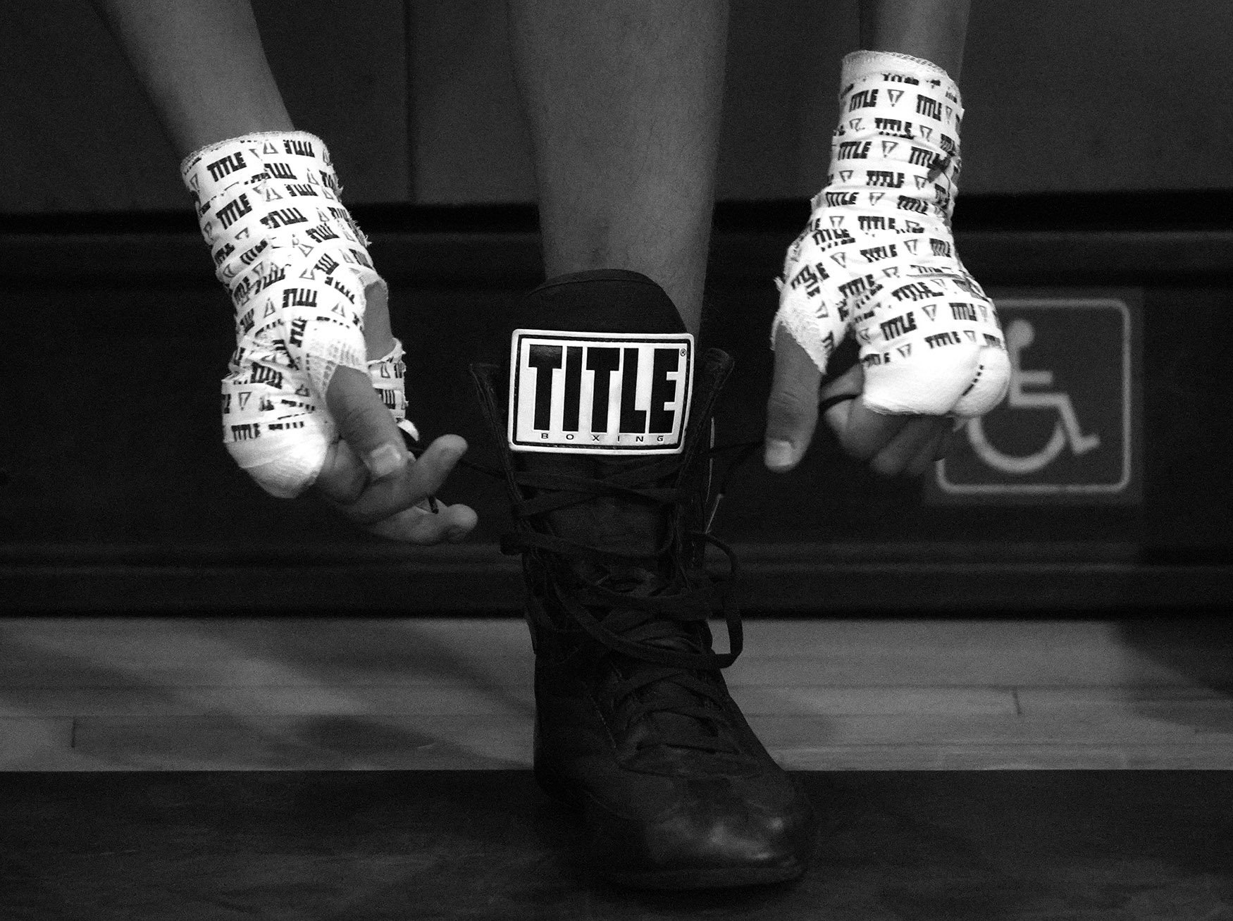  Miguel Rosales Jr ties his shoes prior to his bout during the annual amateur boxing show staged by the Duarte Boxing Club at Duarte High School in Duarte on Saturday, August 13, 2022.  