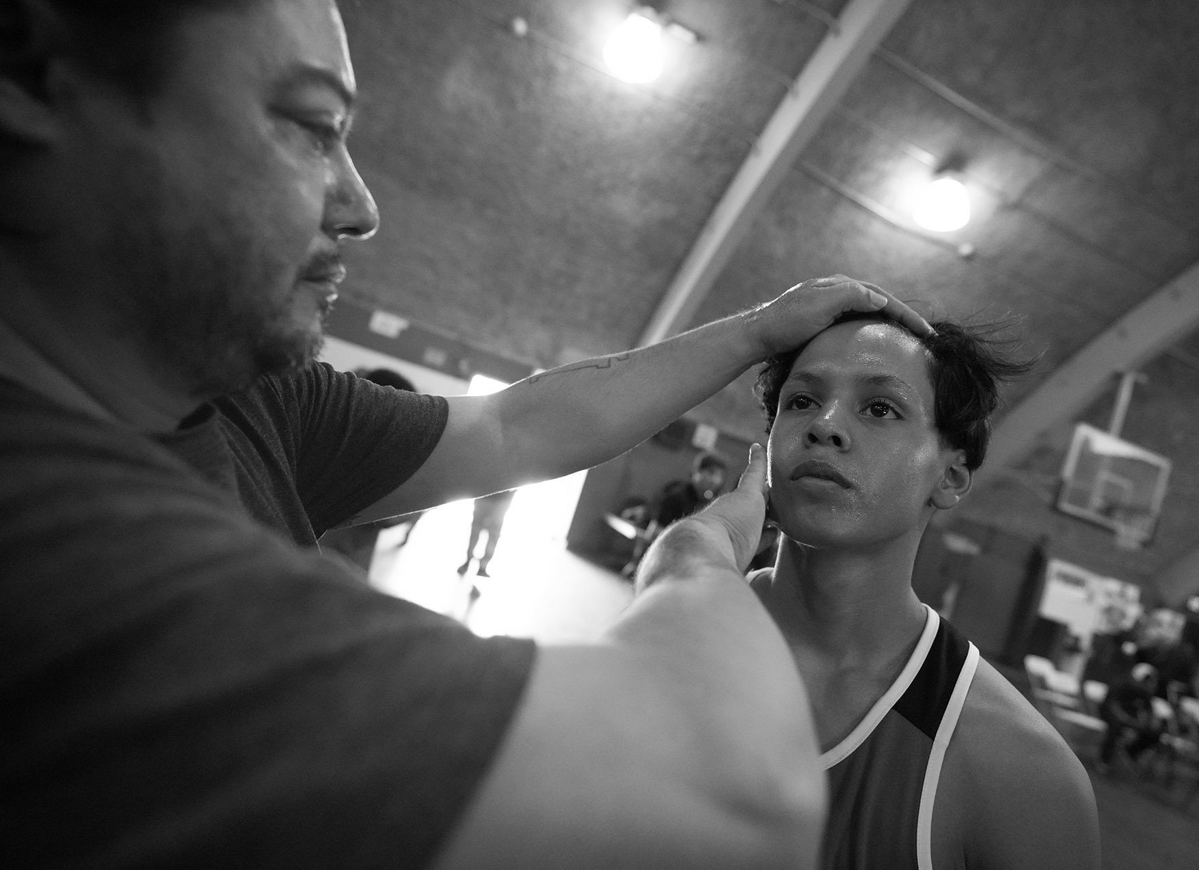  Mondo Castillo prepares his boxer Miguel Rosales Jr. prior to his bout during the annual amateur boxing show staged by the Duarte Boxing Club at Duarte High School in Duarte on Saturday, August 13, 2022.  