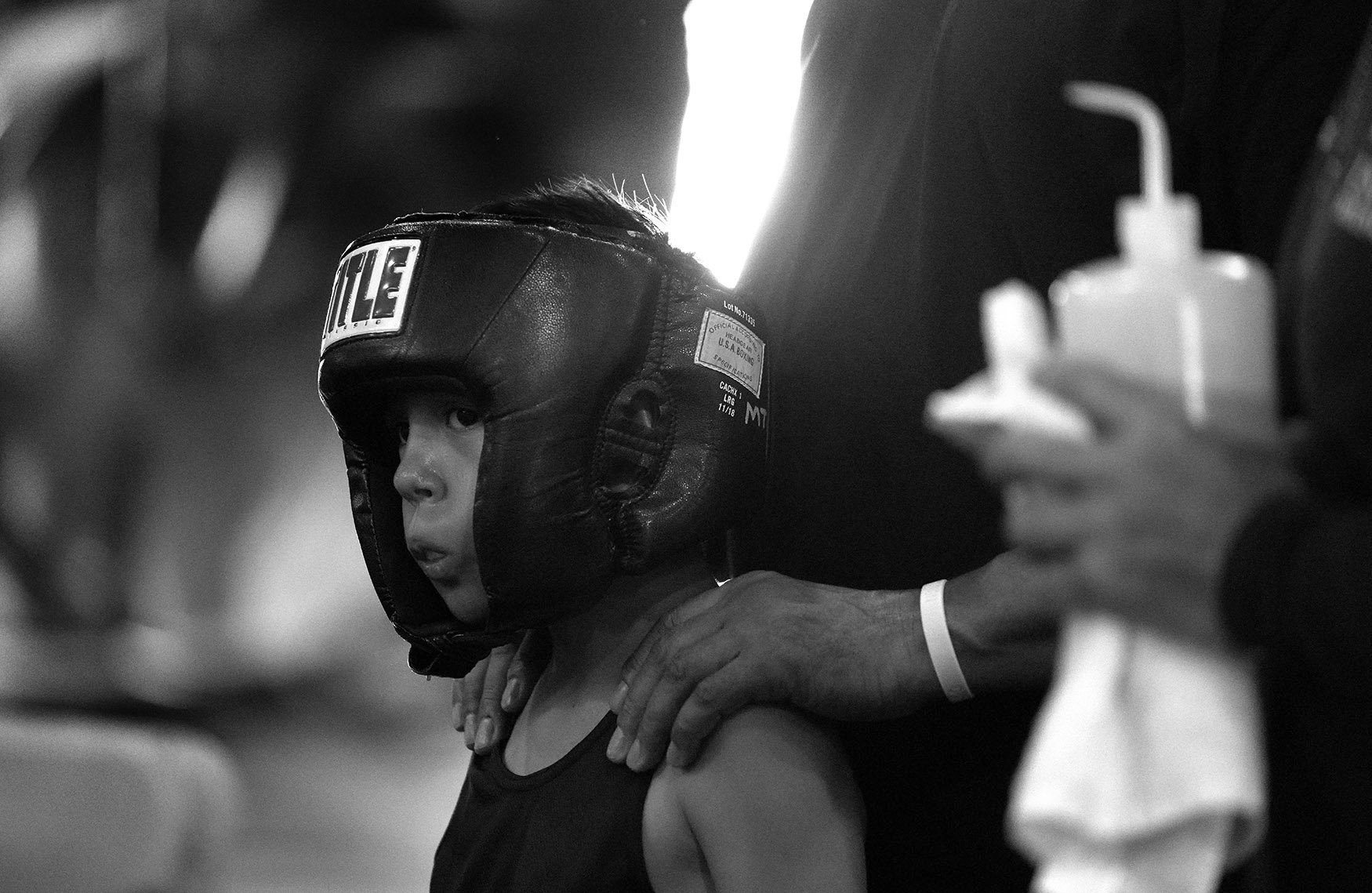  Nine year-old Daniel Ramies waits for his bout during the annual amateur boxing show staged by the Duarte Boxing Club at Duarte High School in Duarte on Saturday, August 13, 2022.  