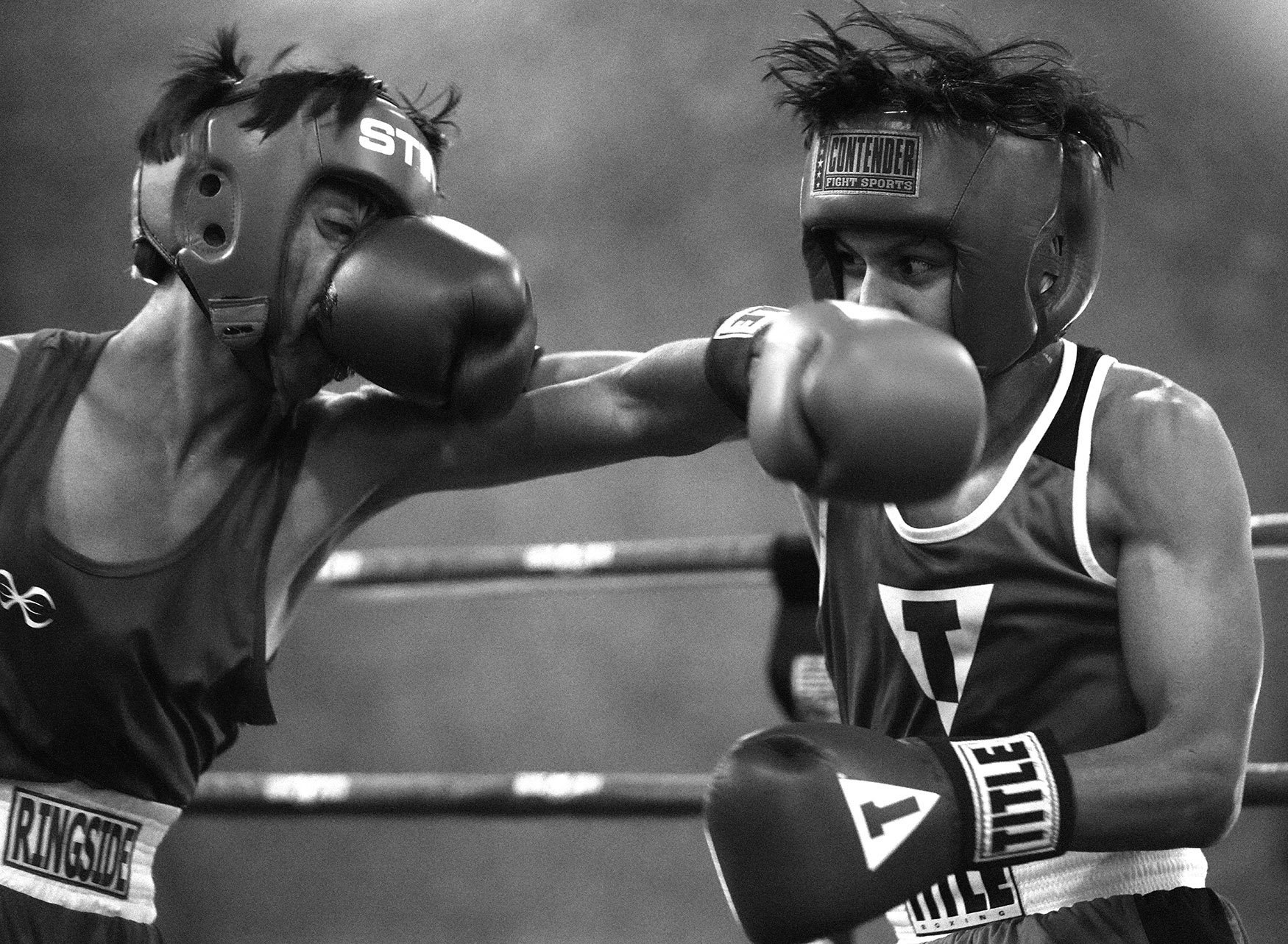 Fourteen year-olds Miguel Rosales Jr., right, of Real Castillo Boxing right, fights Marvin Gomez of Pasadena Boxing during the annual amateur boxing show staged by the Duarte Boxing Club at Duarte High School in Duarte on Saturday, August 13, 2022. 
