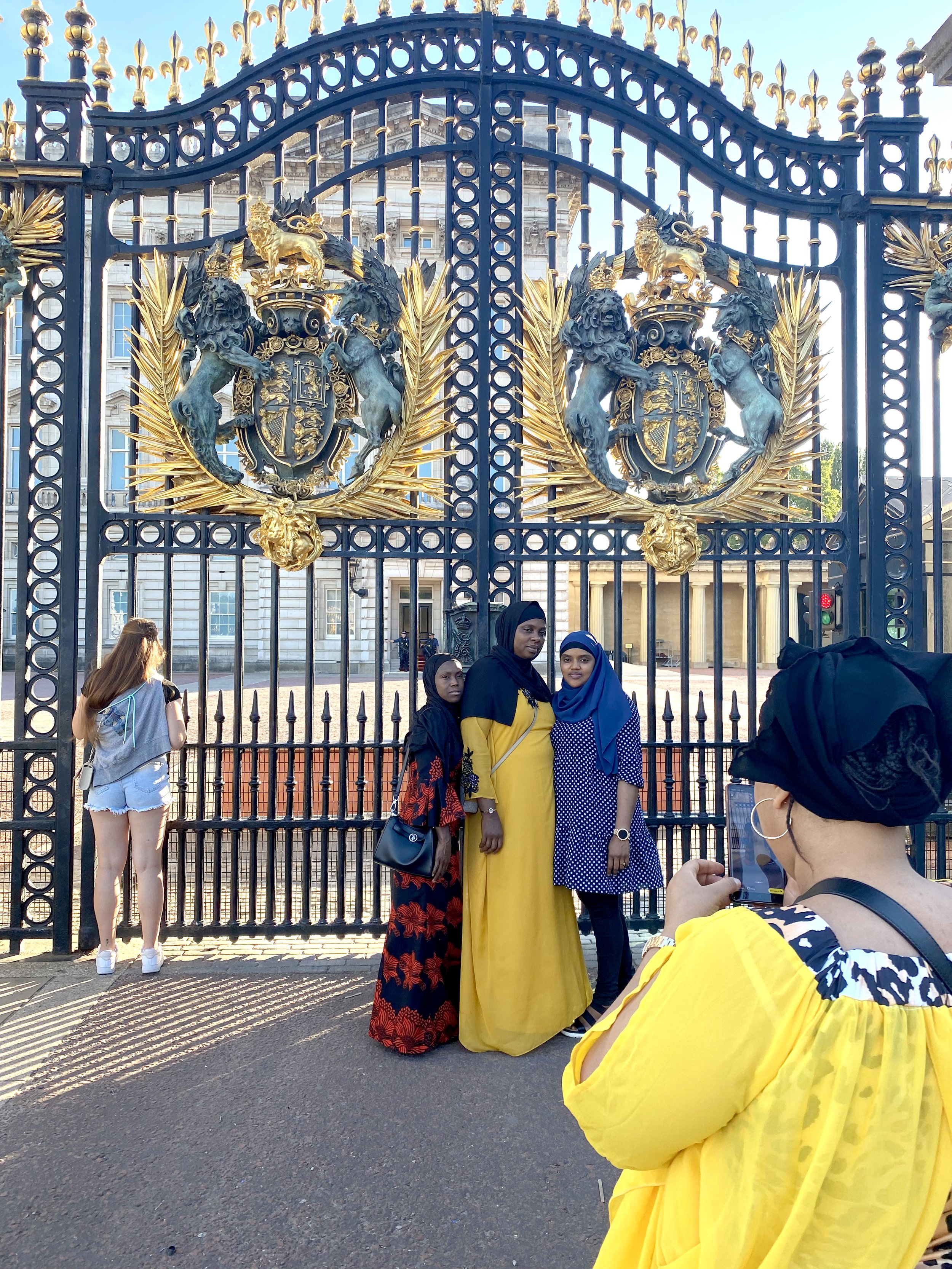  Muslim visitors talk souvenir photos at the gate to Buckingham Palace.  My mother, in particular, loved the history of the British monarchy.  She was born a year earlier than the late Queen Elizabeth II. 