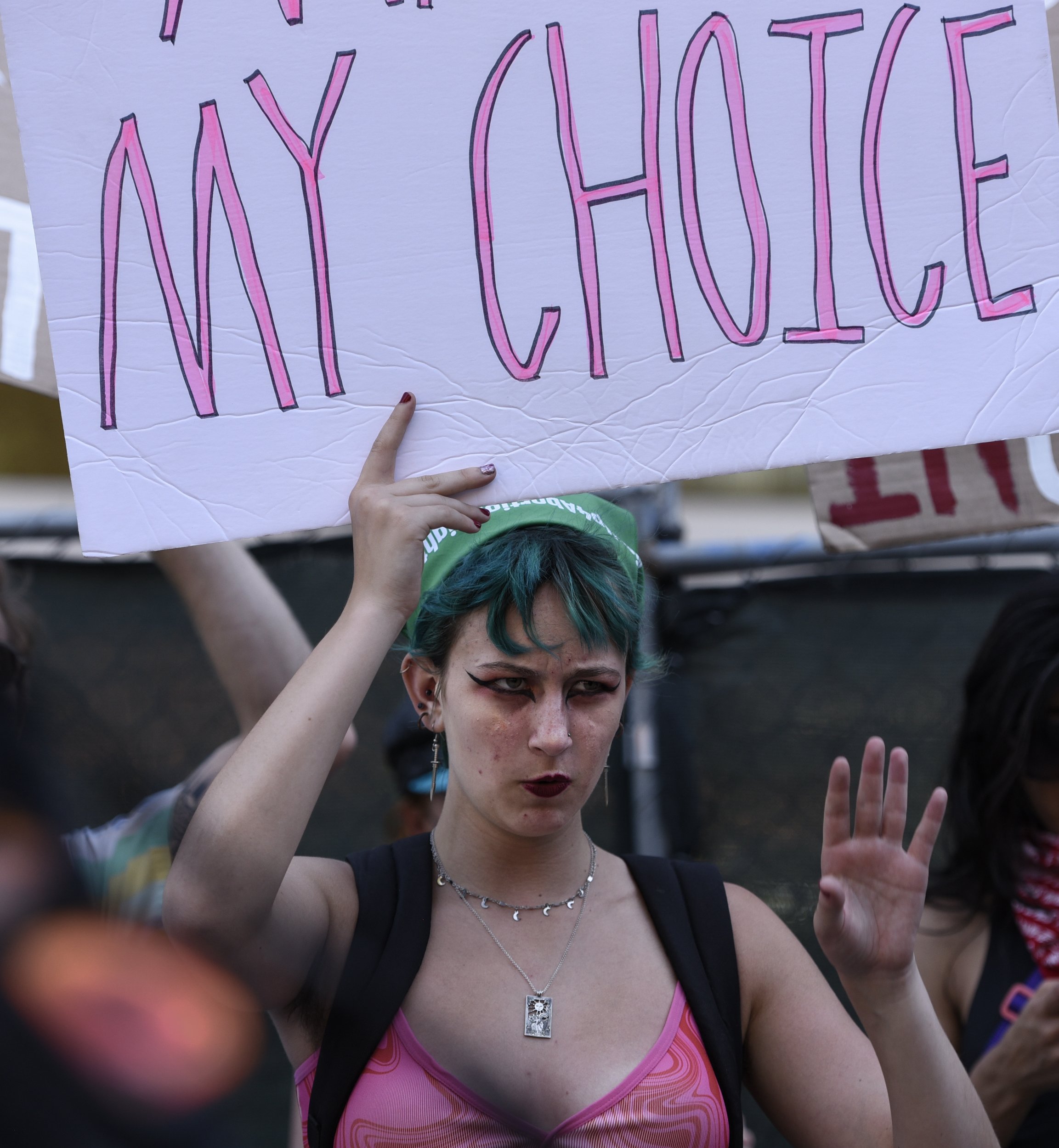  A woman protests outside the courthouse on July 2, 2022 in Los Angeles, Calif. 