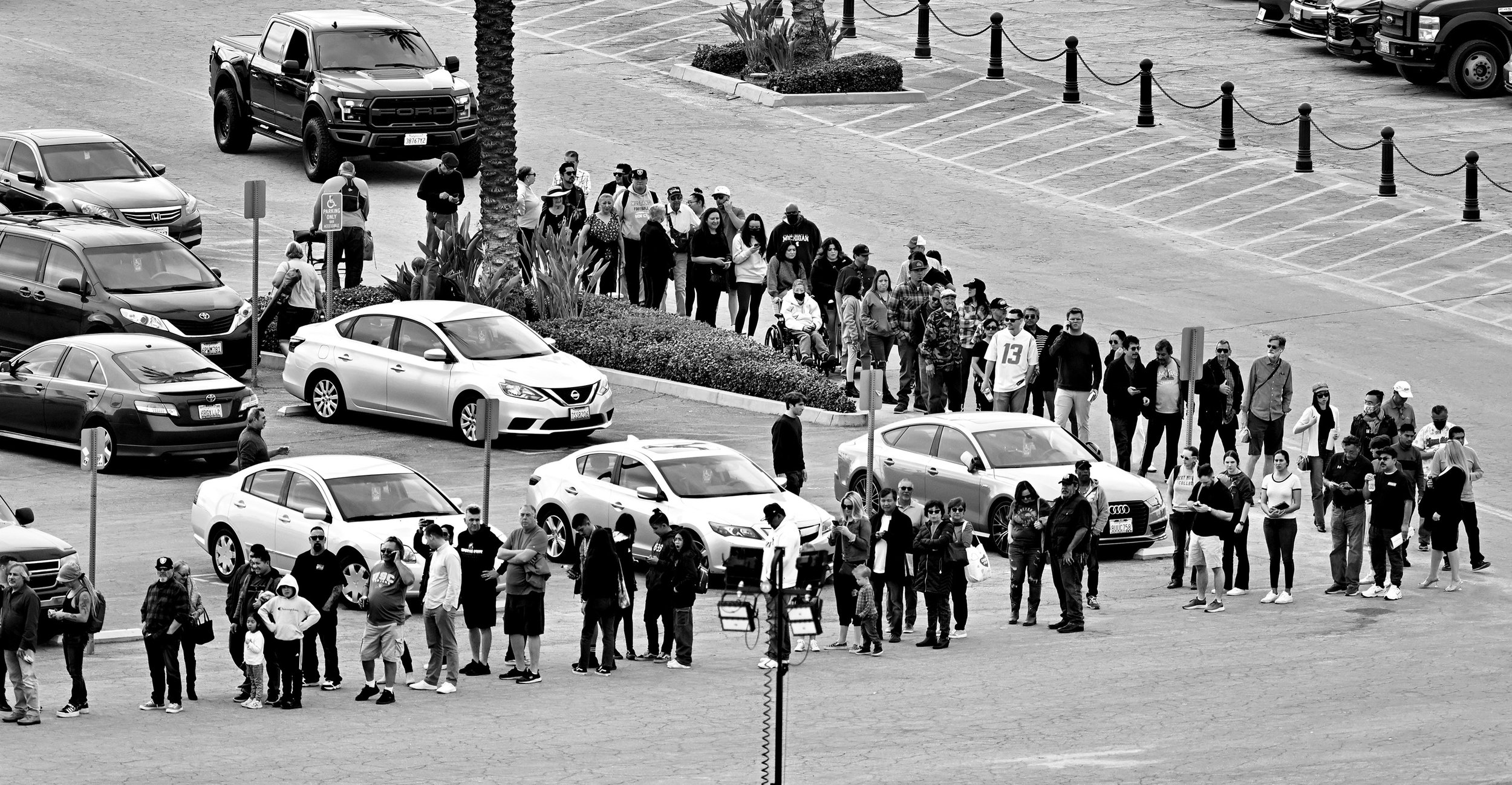  People wait in line in the parking lot to enter on Opening day of the winter-spring meet at Santa Anita Park in Arcadia on Monday, December 26, 2022. The line was so long the track started letting people in for free.  