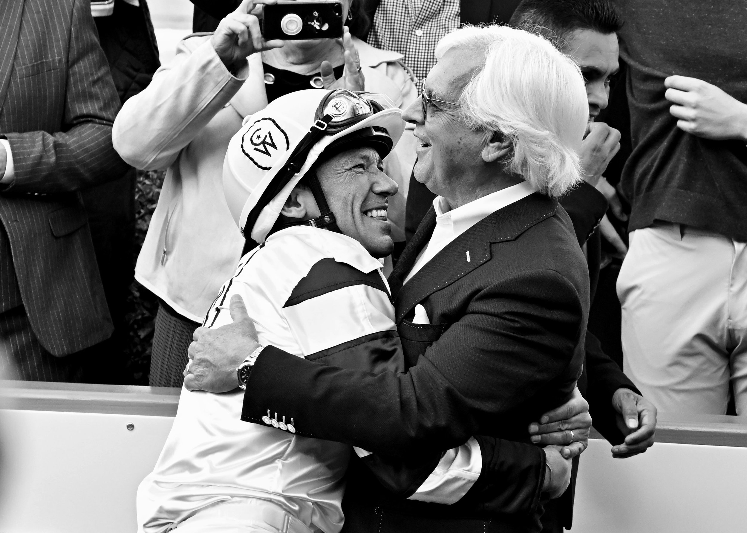  Jockey Lanfranco Dettori, left, hugs trainer Bob Baffert after riding Country Grammer and winning the San Antonio Stakes (Grade II) race during Opening day of the winter-spring meet at Santa Anita Park in Arcadia on Monday, December 26, 2022.  