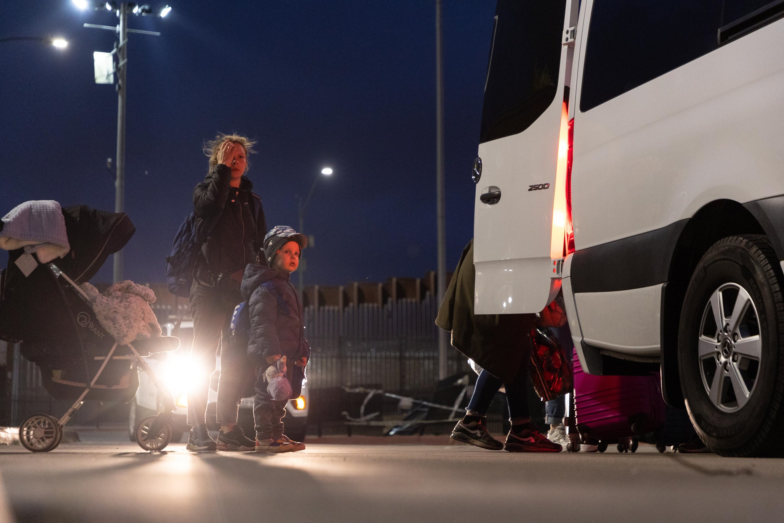  A Ukrainian mother and child wait at the San Ysidro border crossing on April 11, 2022, after having just immigrated to the United States. In the months following Russia's invasion of Ukraine, hundreds of Ukrainian nationals sought refuge in the Unit