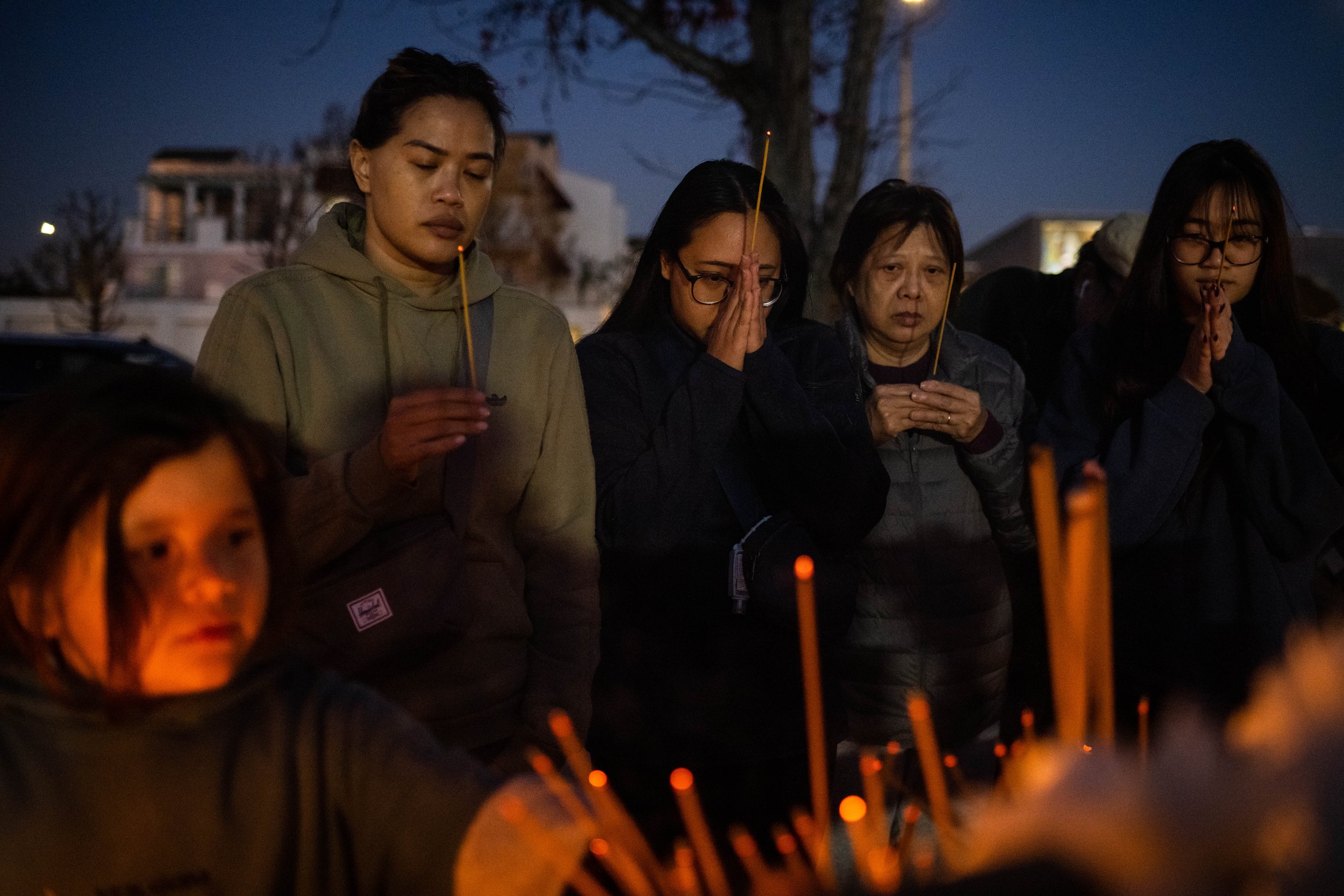  Mourners leave blessings for the victims of the mass shooting at the Star Ballroom Dance Studio at a candlelight vigil at Monterey Park City Hall on Tuesday, January 24, 2023.  