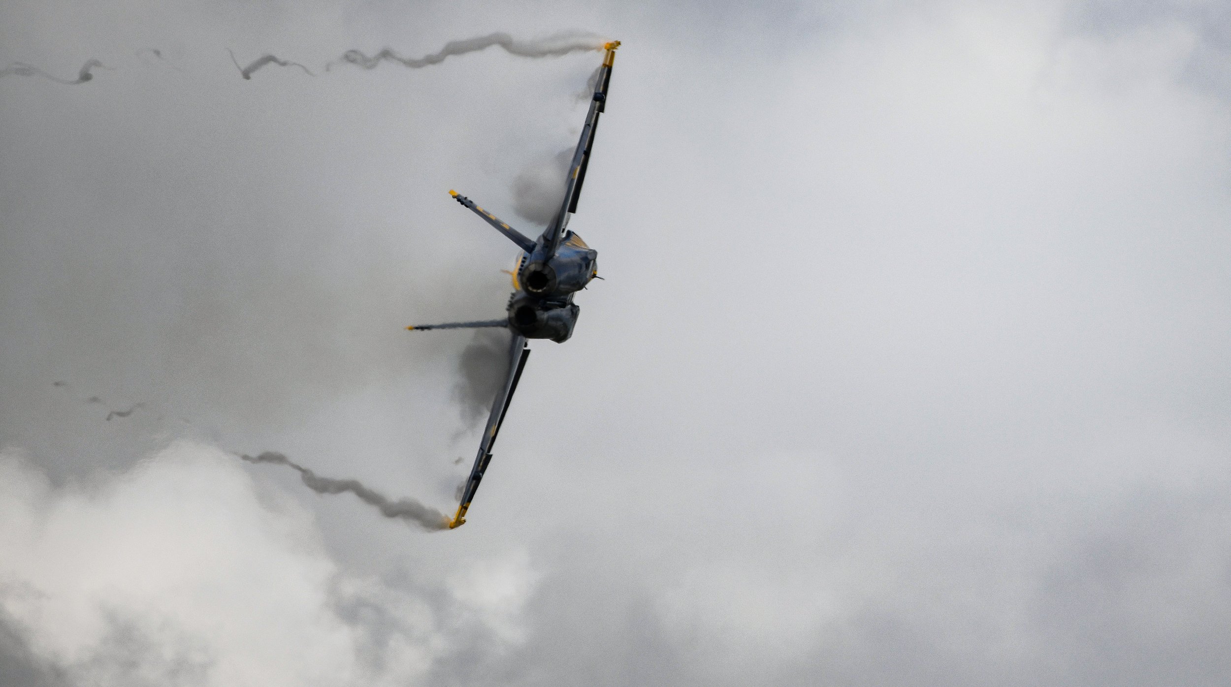  U.S. Navy Flight Demonstration Squadron, ,The Blue Angels, appears through the clouds and rain during a sneak pass March 16 in California. The Blue Angels were the headliner for the 2023 Air Show at Point Mugu March 17-19 in California. High speed a