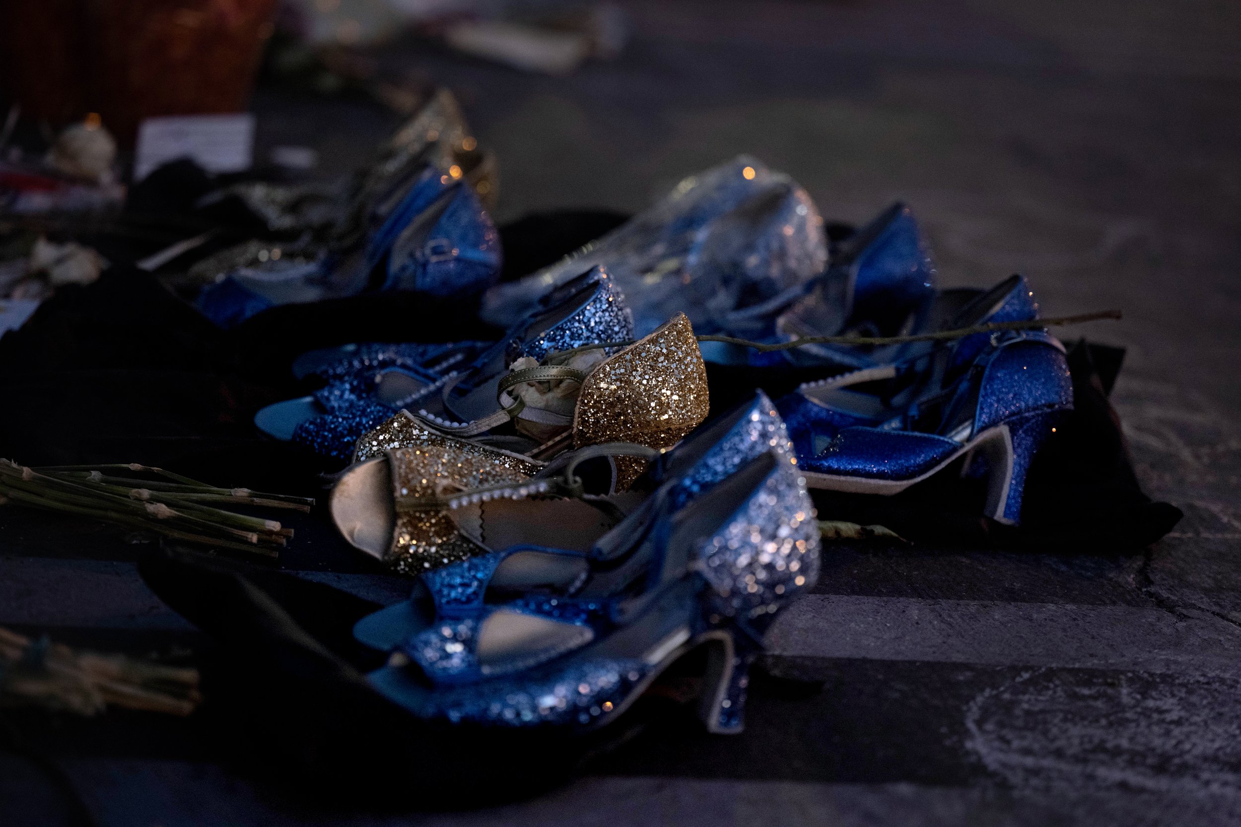  A dancers shoes and their shoe bags are left at the Monterey Park mass shooting makeshift memorial at Star Ballroom Dance Studio as seen on Wednesday, February 15, 2023.  