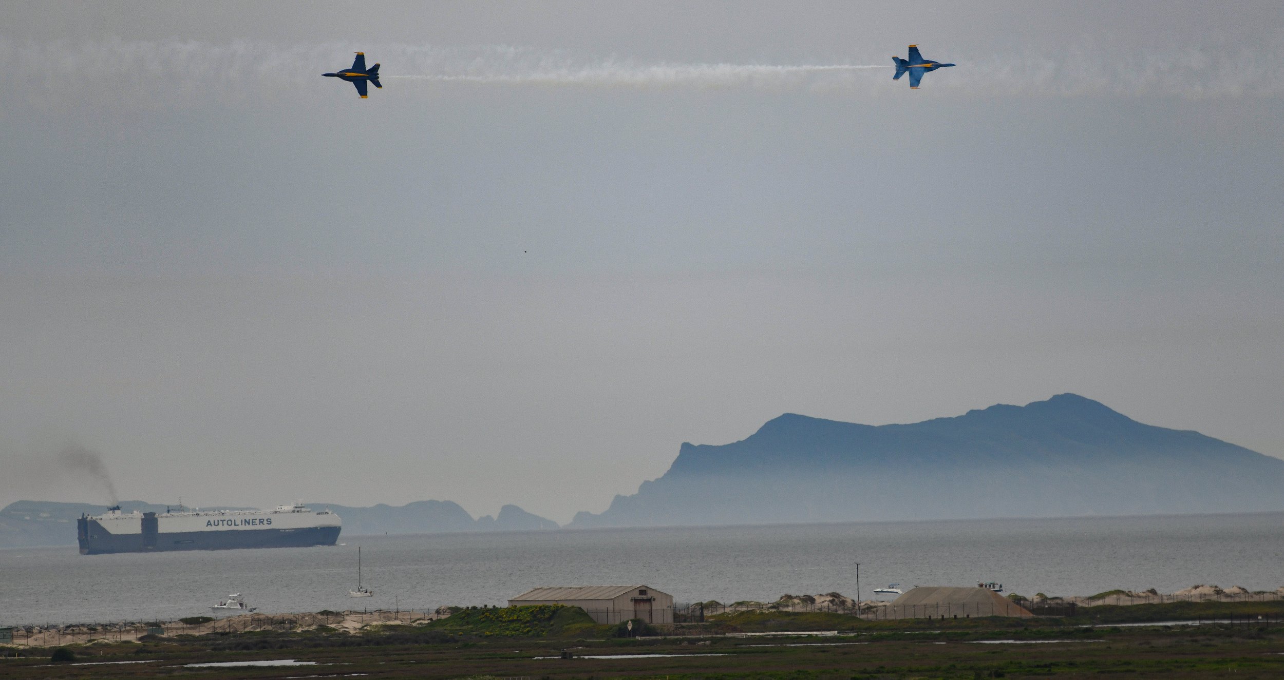  U.S. Navy Flight Demonstration Squadron, the Blue Angels, during an opposing solo pass over Anacapa Island at the 2023 Point Mugu Air Show.  The Blue Angels were the headliner for the Air Show that ran March 17-19 at Naval Base Ventura County in Cal