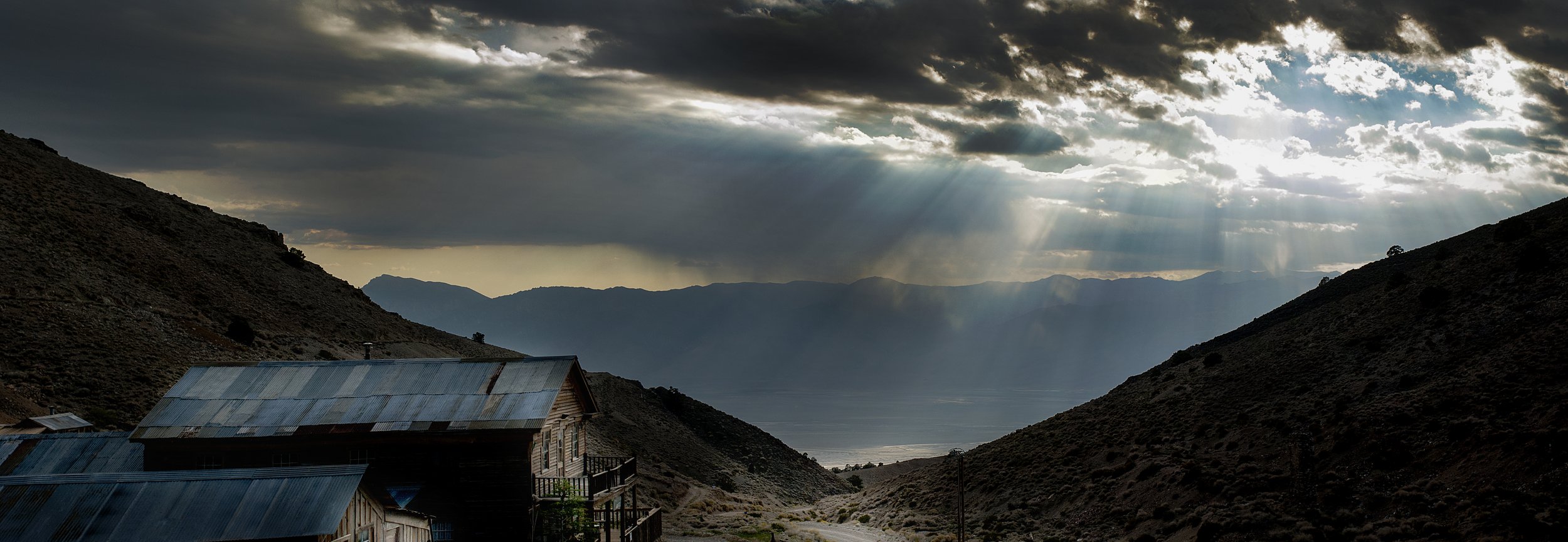  Panoramic view from Cerro Gordo ghost town, looking west over Owens Lake and the Sierra Nevada Mountains. Owens Valley, CA. 