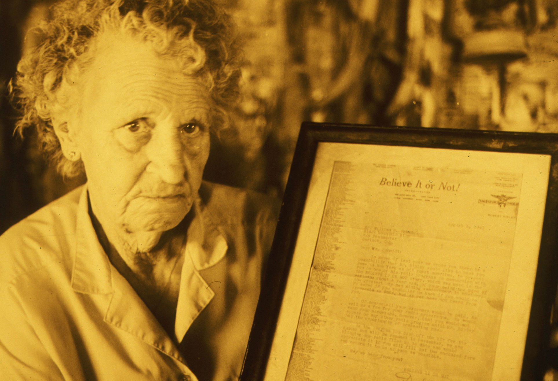  Toni Seger, owner of Burro Schmidt's Tunnel in the El Paso Mountains of Kern Co., displays a lettter from Reipey's Believe It or Not, authenticating the historical significance of the tunnel. 