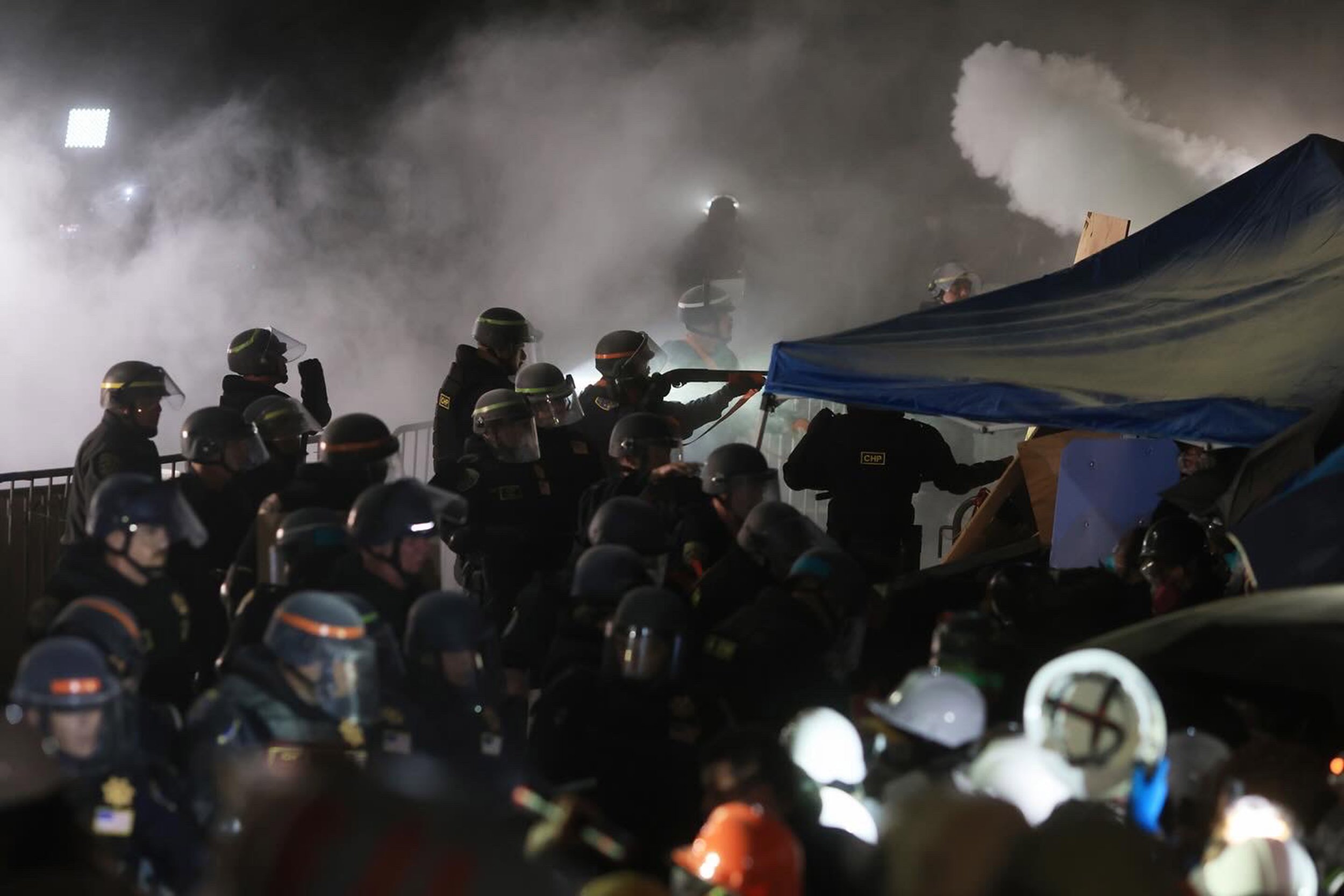  Law enforcement officers enter to clear out the protest encampment in support of Palestinians at the University of California Los Angeles (UCLA), amid the ongoing conflict between Israel and the Palestinian Islamist group Hamas, in Los Angeles, Cali