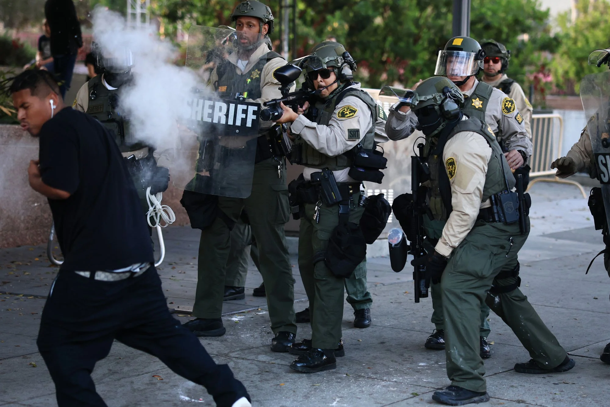  A man is shot point blank by a Los Angeles Sheriff during a protest against federal immigration sweeps, in downtown Los Angeles, California. 