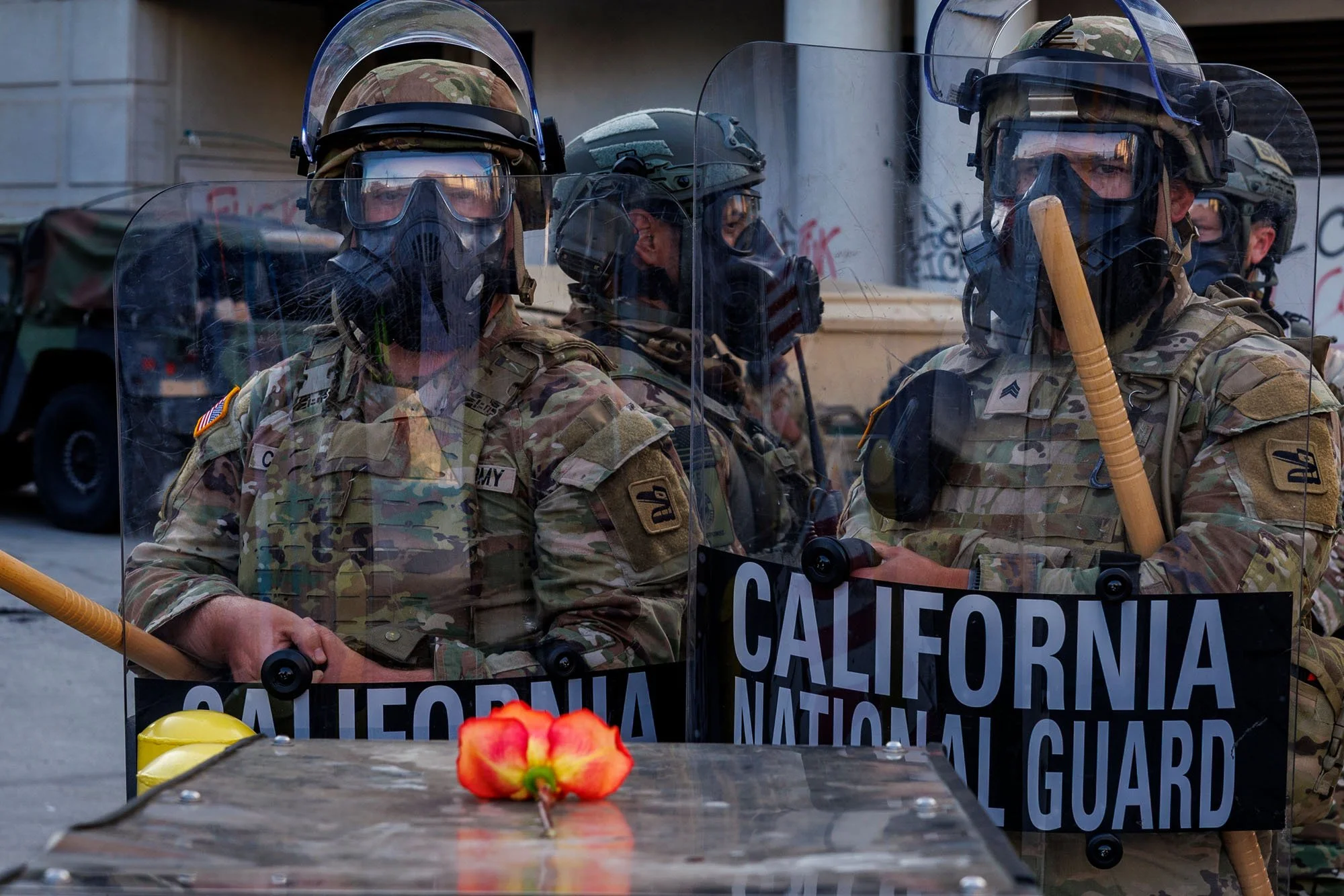 LOS ANGELES, CA - A flower was placed in front of the California National Guard on the backside  of the Federal Building during anti-immigration protests on Alameda Street  on June 12, 2025 in Los Angeles, California. 