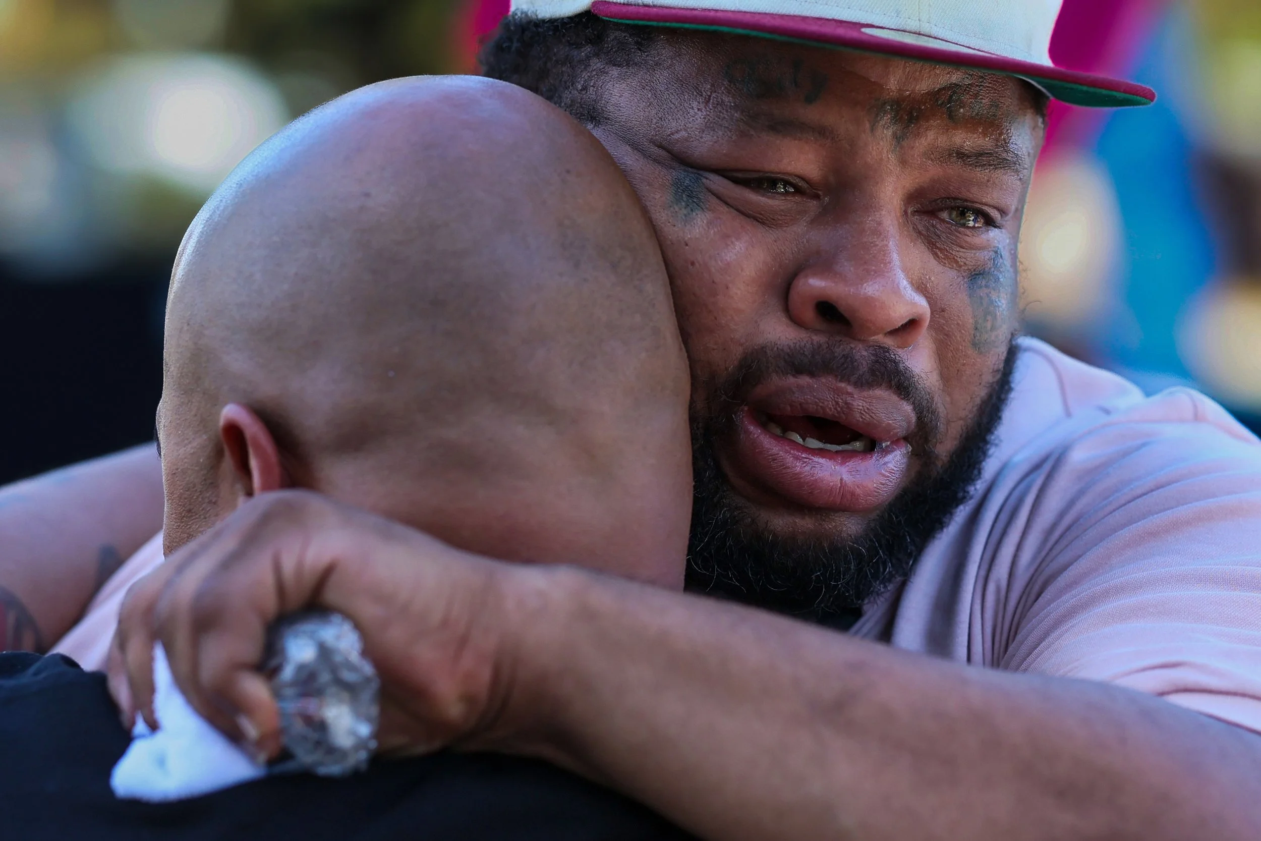  Los Angeles, CA, Tuesday, July 8, 2025 - Daniel Ware weeps as friends and family gather to demonstrate at the site where his brother, Richard Ware was stabbed to death. Chronically homeless, Richard lived in a shelter nearby, that family members cla