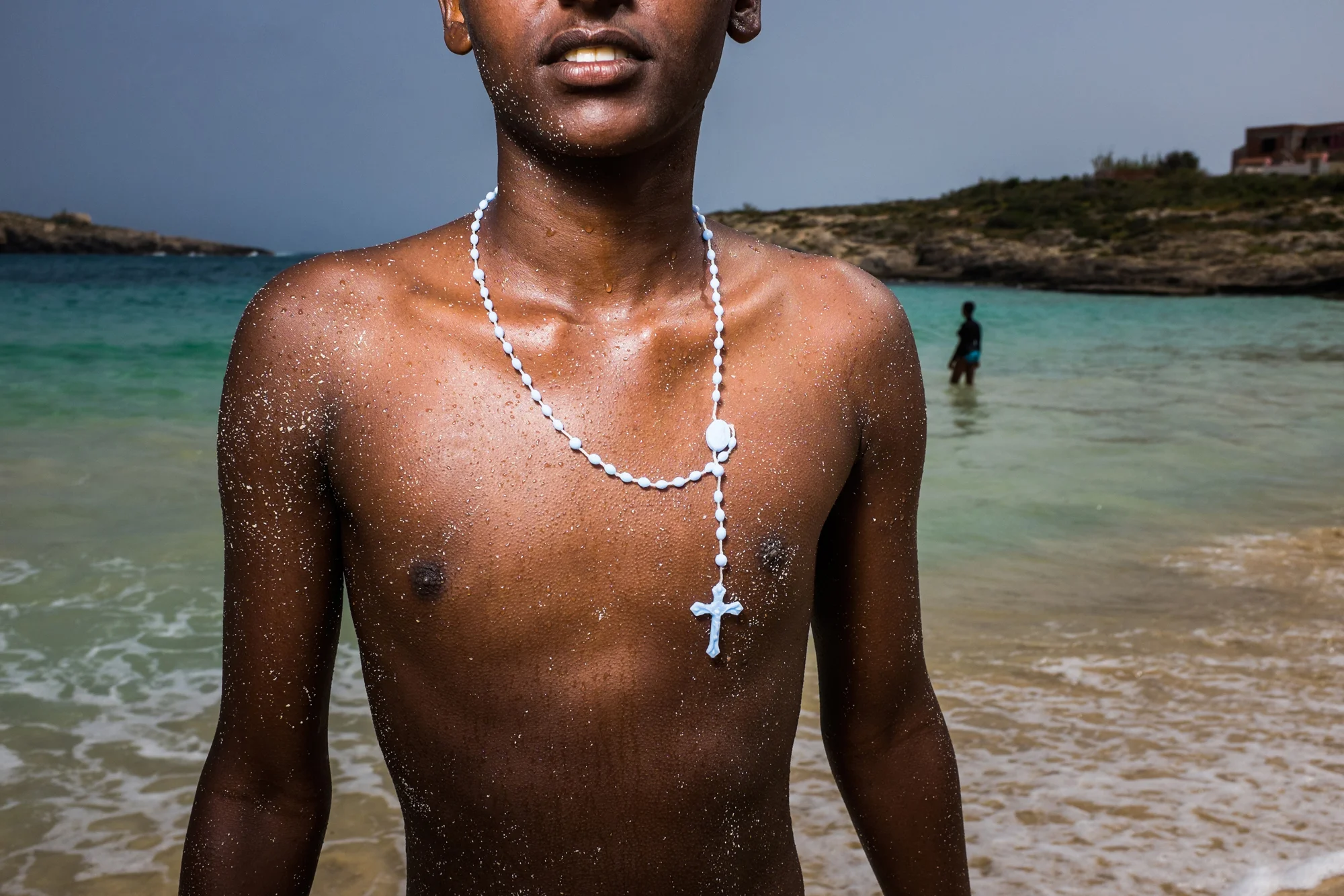 Eritrean Refugee who took the treacherous  journey across the Mediteranean two weeks ago, goes for a swim with his friends.