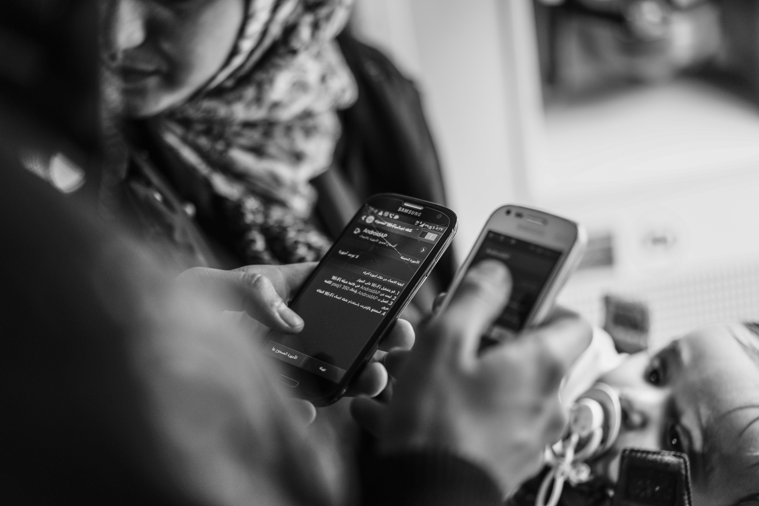 "My sister My sister" she asks a fellow refugee what carrier he has, and if he can create a wireless network for her. she does not reach her sister and eventually gets off