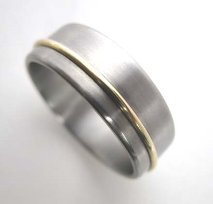 Titanium band with 18K gold wire.