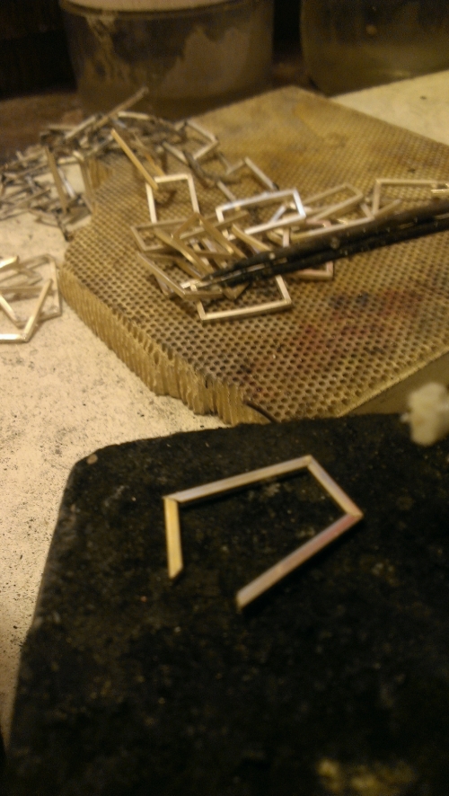 A link bent into shape and ready for soldering. 