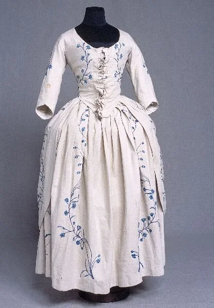 Original 18th century gown embellished with embroidery.