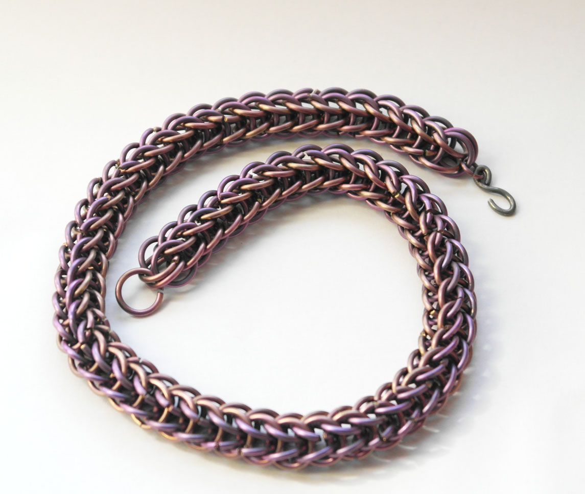 A anodized titanium necklace, in a persion weave.